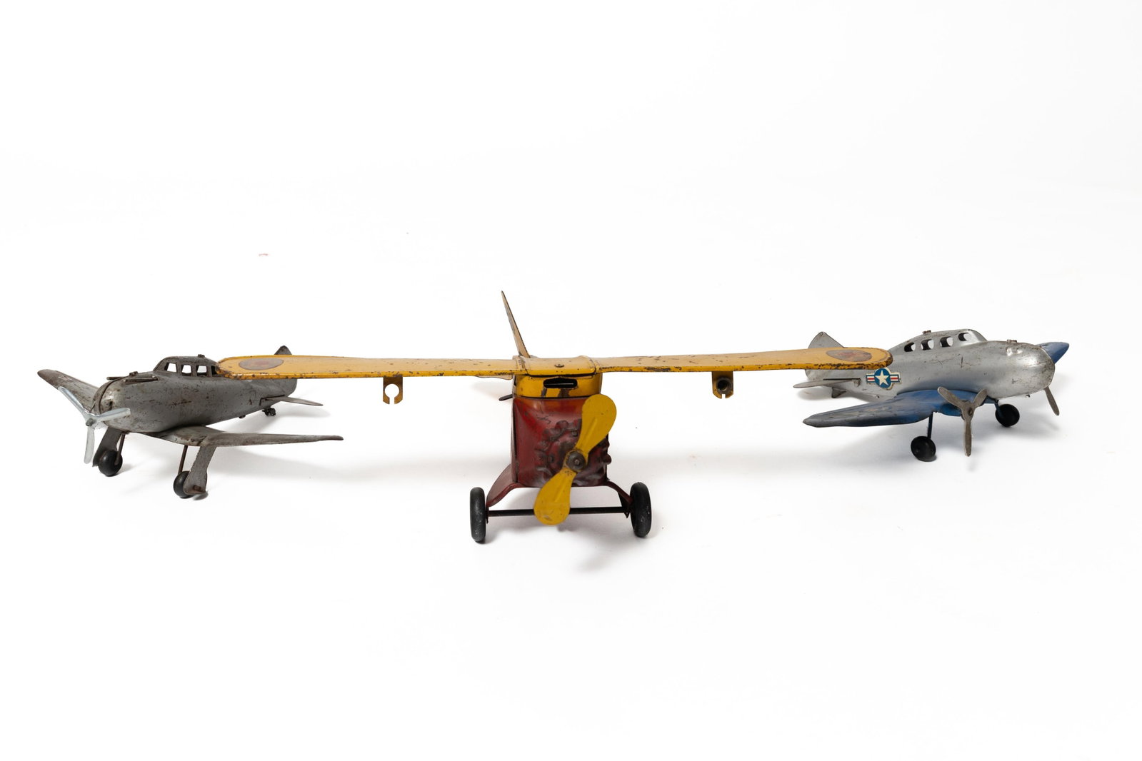 THREE PRESSED STEEL TOY AIRPLANES. (1 of 3)