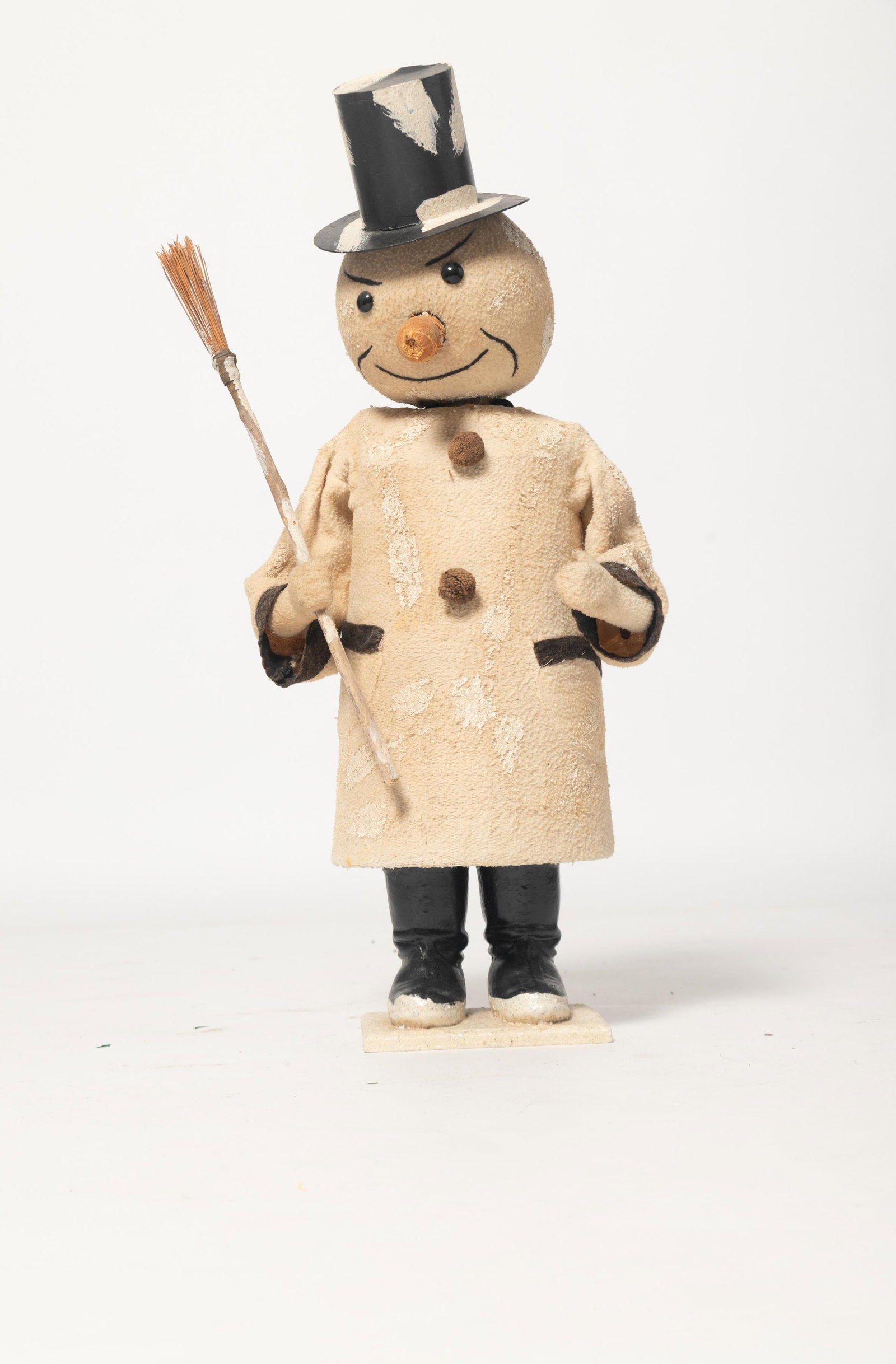 LARGE STORE DISPLAY CLOCKWORK NODDING SNOWMAN.: LARGE STORE DISPLAY CLOCKWORK NODDING SNOWMAN. Germany, early 20th Century. A snowman wearing an orange carrot nose, black glass eyes, a snow-covered top hat, a white coat with black cuffs and two
