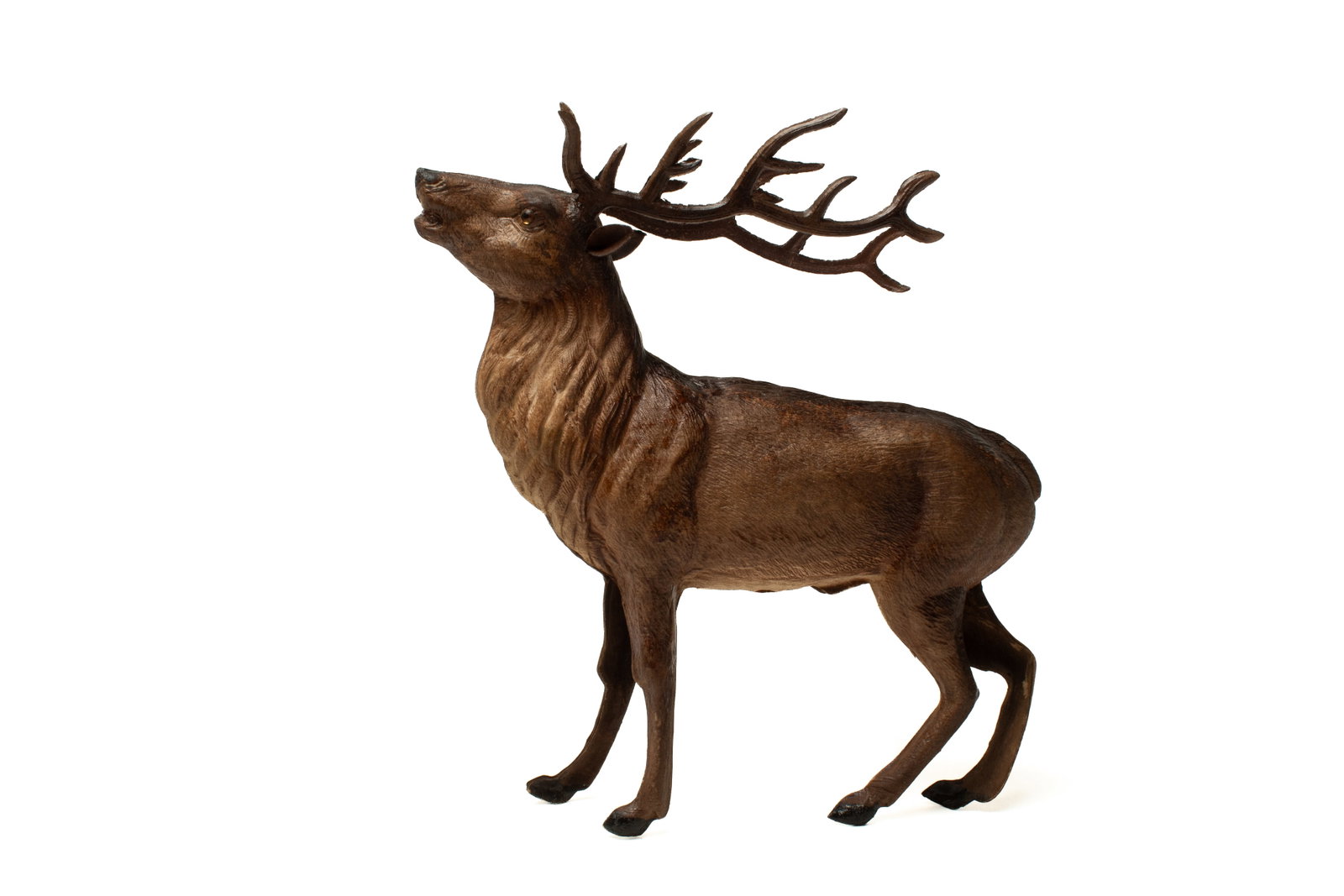 DRESDEN REINDEER FIGURE.: DRESDEN REINDEER FIGURE. Germany, early 20th Century. Typical embossed pressed cardboard body, large antlers, and glass eyes. 8"h. 8"w. Provenance: Nancy Goff (Alliance, Ohio).