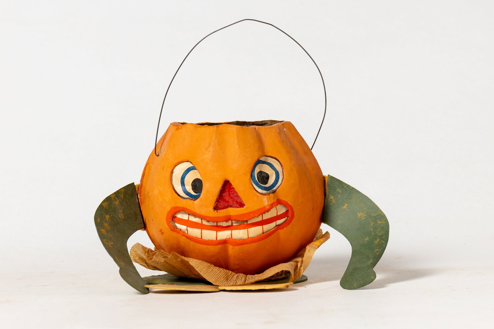 HALLOWEEN PUMPKIN LANTERN WITH ARMS AND LEGS.: HALLOWEEN PUMPKIN LANTERN WITH ARMS AND LEGS. American, 20th Century. A pumpkin head with cardboard arms and legs attached to body with felt strips, a crepe paper collar, candle holder inside, with a