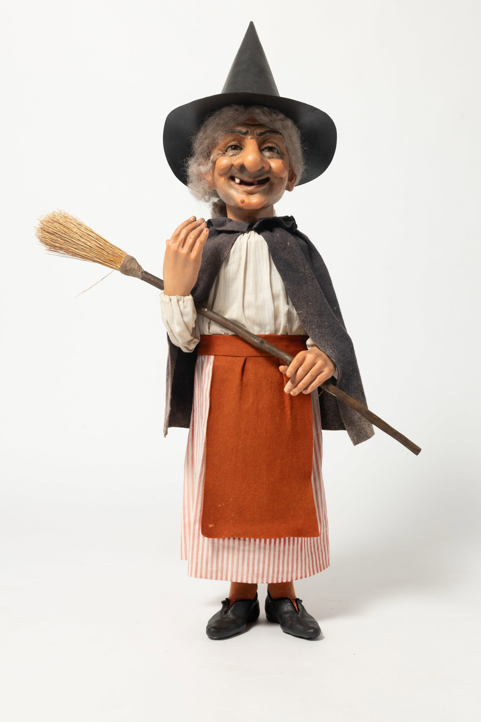 LARGE STORE DISPLAY WITCH CANDY CONTAINER.: LARGE STORE DISPLAY WITCH CANDY CONTAINER. Germany, early 20th Century. Composition face, hands, and shoes, she has brown glass eyes, a wart on her chin and cheek, two molded teeth, and wears her