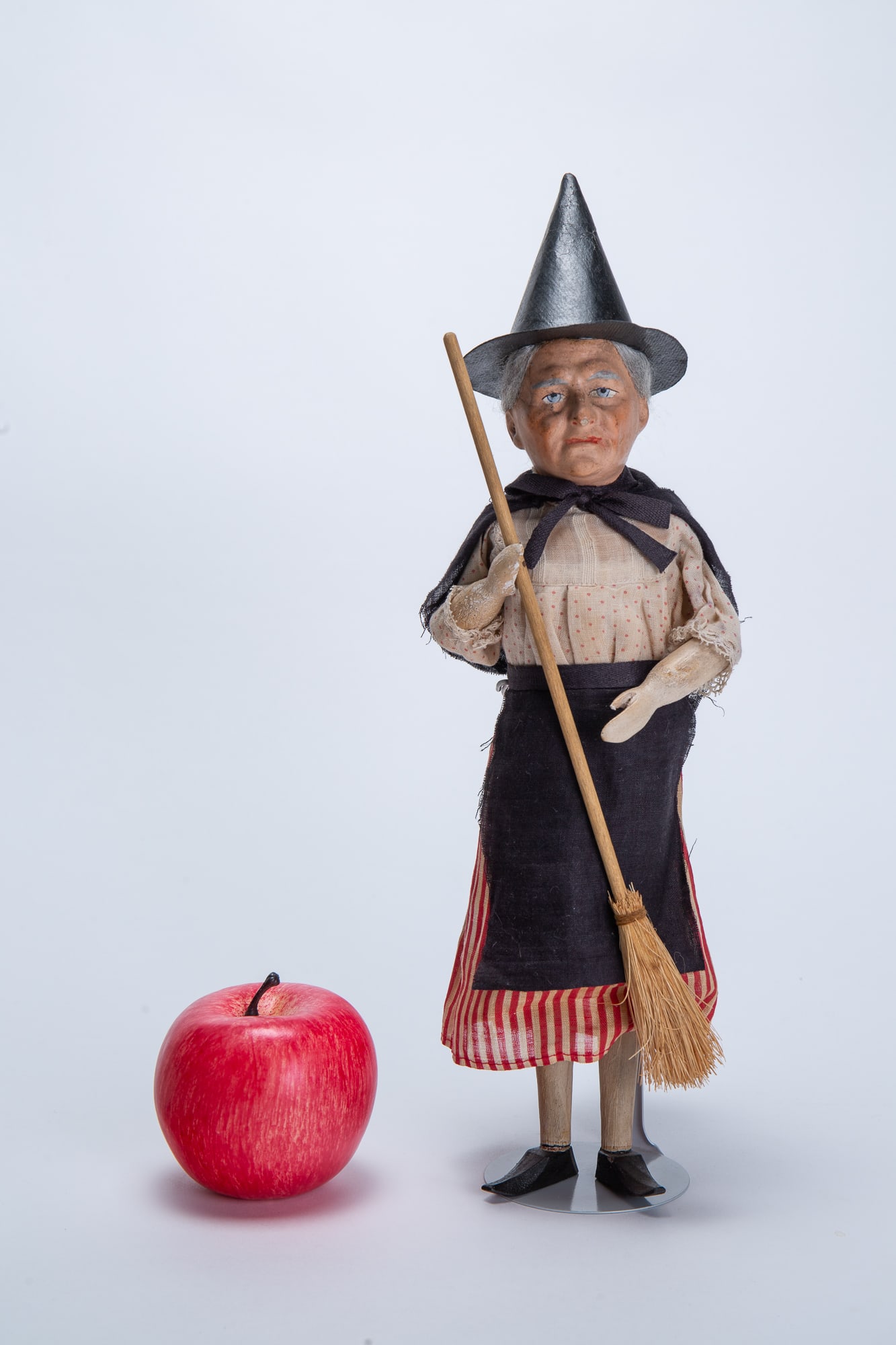 LARGE STANDING WITCH WITH BROOM STORE DISPLAY HALLOWEEN CANDY CONTAINER.: LARGE STANDING WITCH WITH BROOM STORE DISPLAY HALLOWEEN CANDY CONTAINER. Germany, late 19th or early 20th Century. The standing witch with grey hair, composition face, original clothes, and wood arms