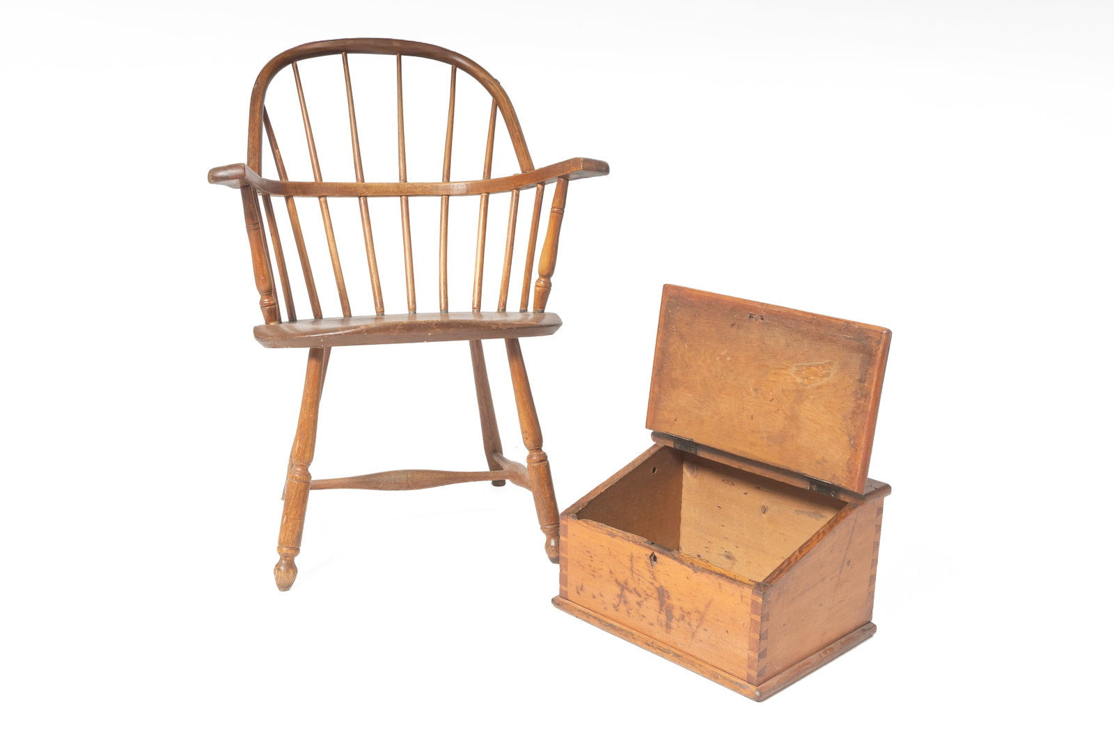 WINDSOR ARMCHAIR AND A COUNTERTOP CLERK'S DESK.: WINDSOR ARMCHAIR AND A COUNTERTOP CLERK'S DESK. American, 19th Century. Sack-back chair in mixed woods, spindle back, oval seat and turned stiles, legs and stretchers, 18" seat h. 35"h. And a pine