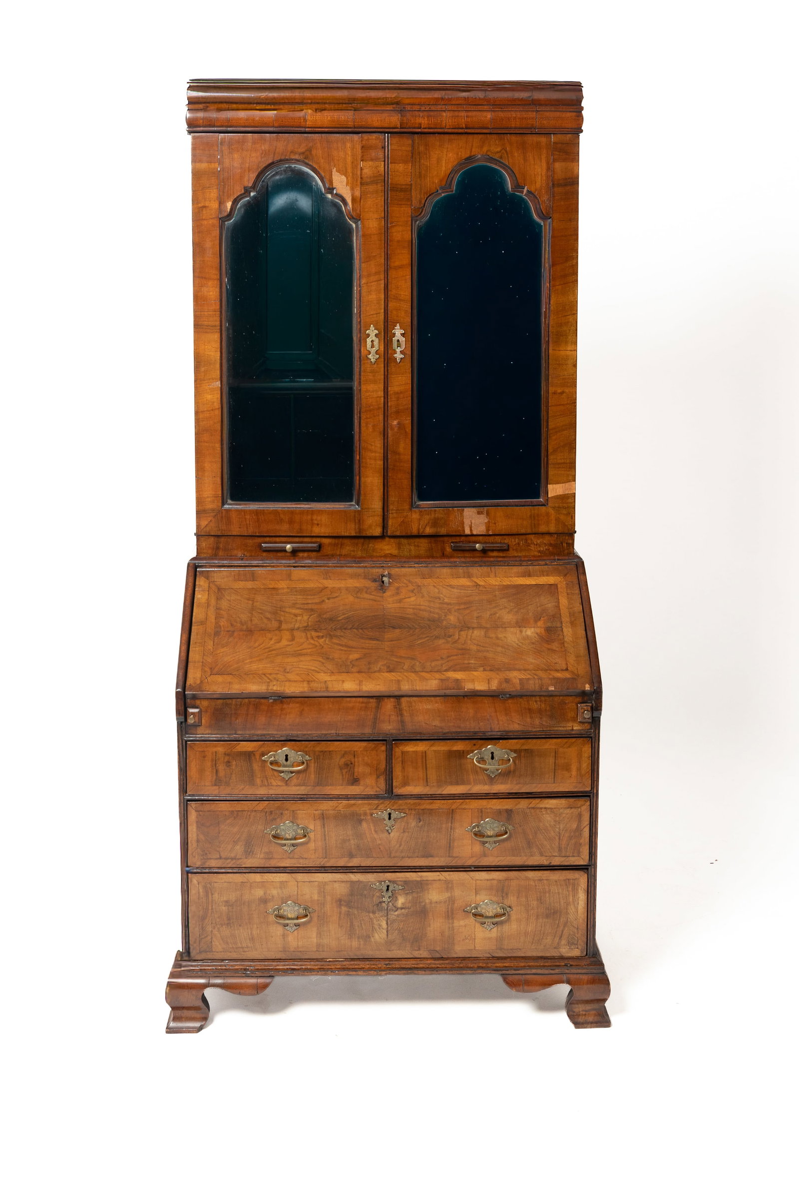 QUEEN ANNE SECRETARY BOOKCASE.: QUEEN ANNE SECRETARY BOOKCASE. English, late 18th Century. Mahogany with oak secondary. In two pieces. Top with coved moldings, beveled mirrors with Queen Anne period arched tops, two lower pull-out