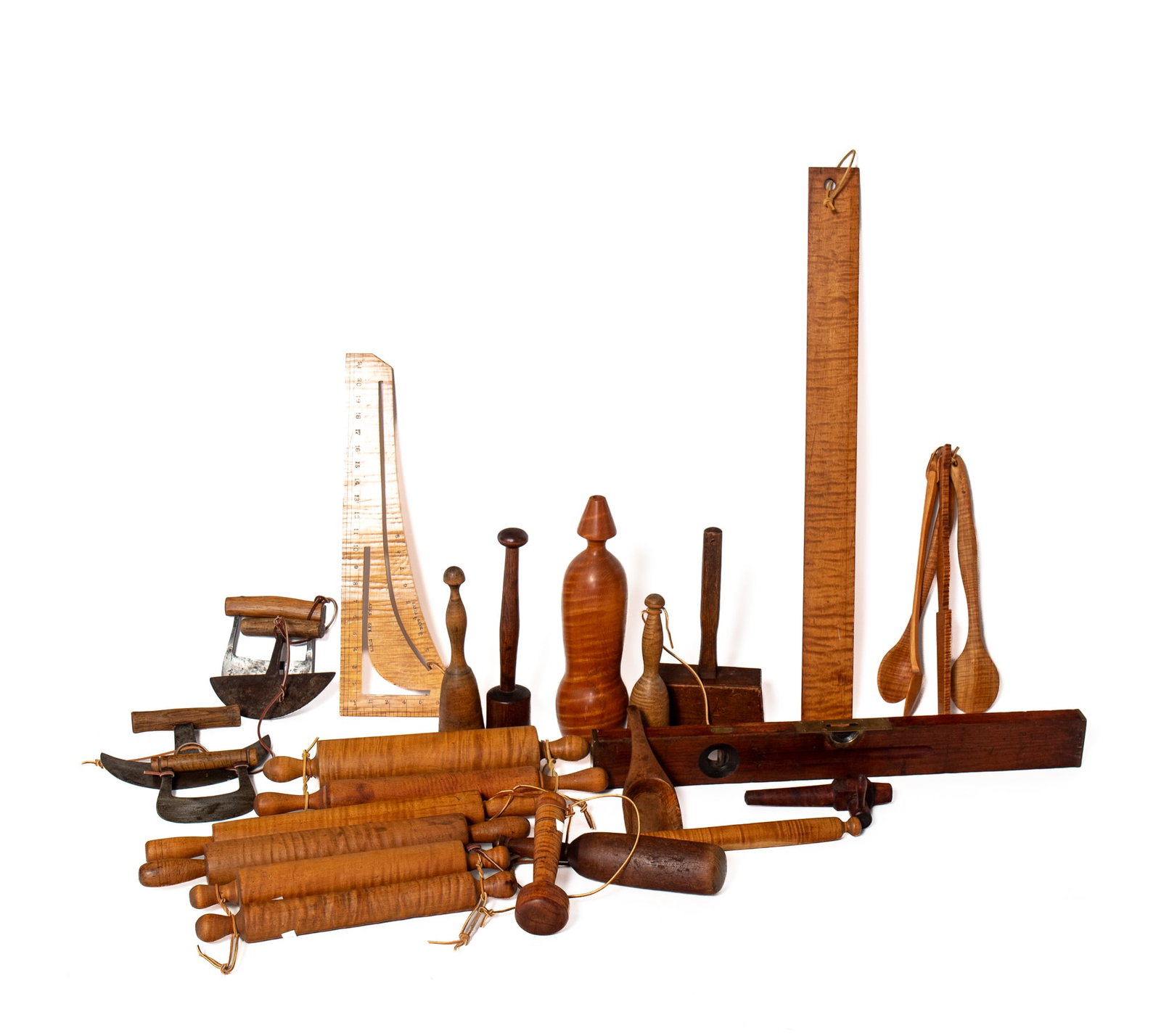 COLLECTION OF TOOLS AND UTENSILS, MOSTLY TIGER MAPLE.: COLLECTION OF TOOLS AND UTENSILS, MOSTLY TIGER MAPLE. 19th and 20th Century. Rolling pins, potato mashers, food choppers, scoop, bung, mallet, 33" long, a straight edge, A.J. PRATT, CHICAGO 21"