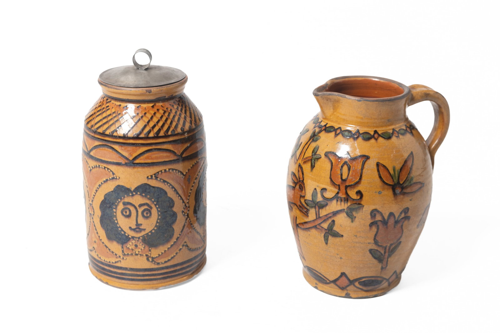 GREG SHOONER (OREGONIA, OHIO, B. 1953) GLAZED REDWARE POTTERY PITCHER AND JAR.: GREG SHOONER (OREGONIA, OHIO, B. 1953) GLAZED REDWARE POTTERY PITCHER AND JAR. American, contemporary. Each signed and dated on underside. Ovoid pitcher with orange and brown animal and floral motifs