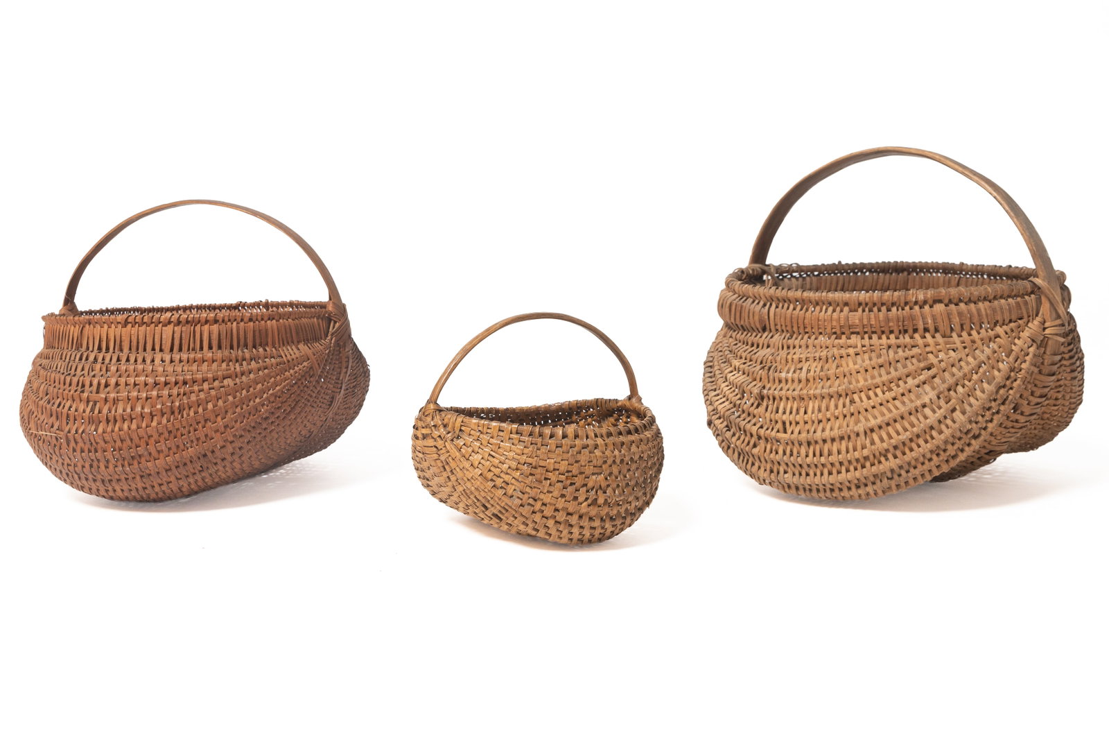THREE SPLINT-WOVEN BUTTOCKS BASKETS. (1 of 20)