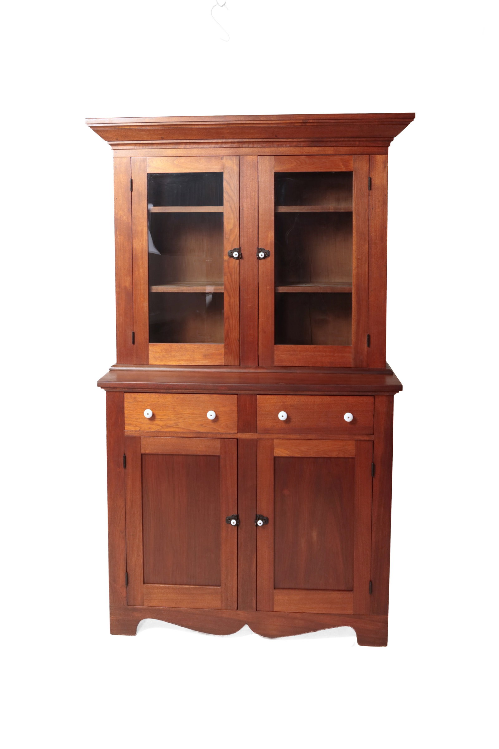 COUNTRY VICTORIAN STEPBACK CUPBOARD.: COUNTRY VICTORIAN STEPBACK CUPBOARD. American, mid- 19th Century. Walnut with pine secondary. In two pieces. Top with beveled cornice moldings, two single-pane glass doors with center stile. Base