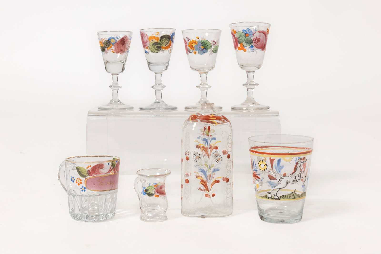 EIGHT STIEGEL STYLE BLOWN AND ENAMELED GLASS ITEMS.: EIGHT STIEGEL STYLE BLOWN AND ENAMELED GLASS ITEMS. American and English, late 18th or early 19th Century. All eight have multi-colored floral enamel decoration and broken pontils. Half-post bottle,