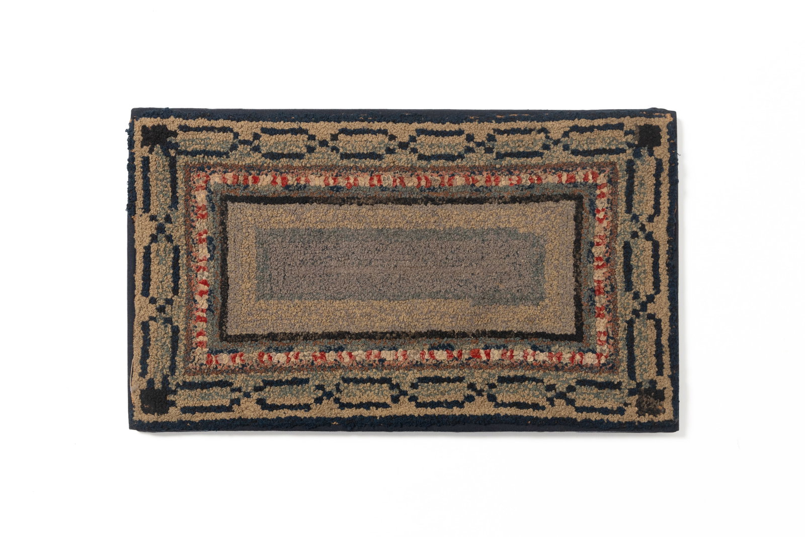 MOUNTED YARN SEWN RUG.: MOUNTED YARN SEWN RUG. American, 19th Century. Having polychrome rectangles with a blue chain-link border, mounted onto a navy blue fabric backing and wooden stretcher. 17"h. 29"w.
