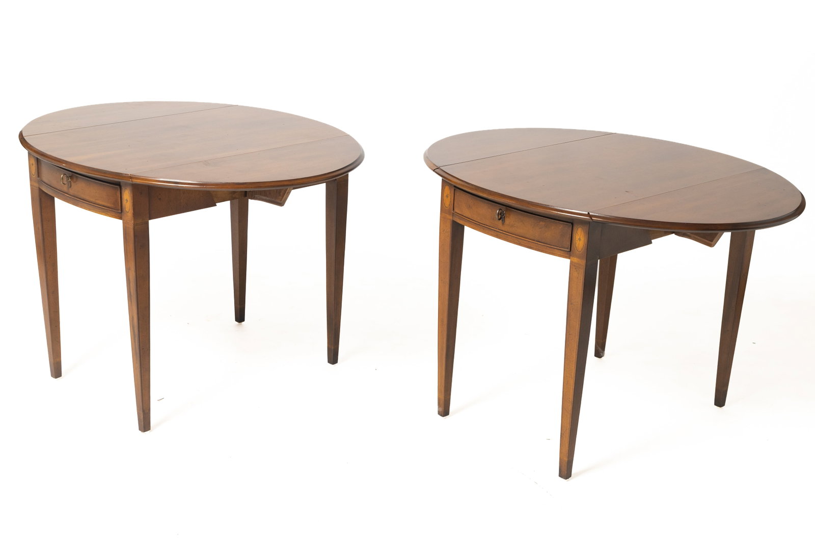 TWO HENREDON PEMBROKE TABLES.: TWO HENREDON PEMBROKE TABLES. American, 20th Century. Leaves with rounded edges, dovetailed drawer, and inlaid tapered legs. 27"h. 20.5"w. 32"d. open, 40"w.