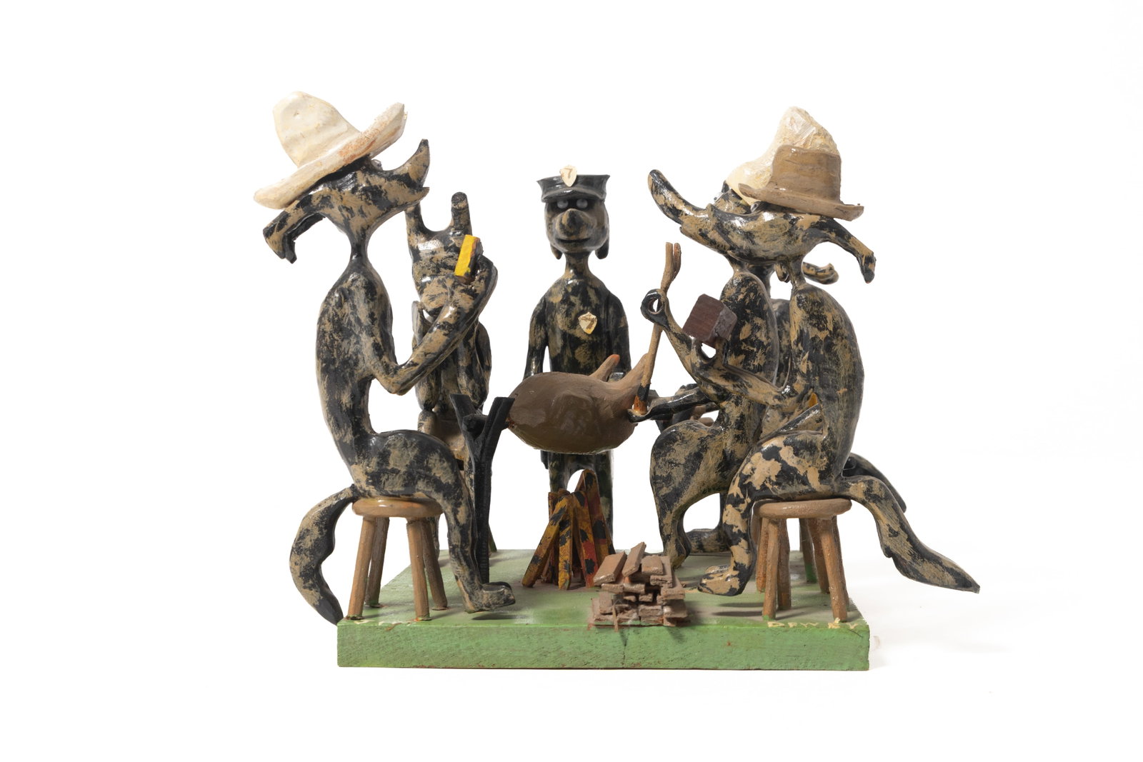AMERICAN FOLK ART CARVED FIGURAL SCULPTURE.: AMERICAN FOLK ART CARVED FIGURAL SCULPTURE. 20th Century. Mixed media. Whimsical hand-carved and painted depiction of a woodland campfire gathering. Showing anthropomorphic dogs sitting around a