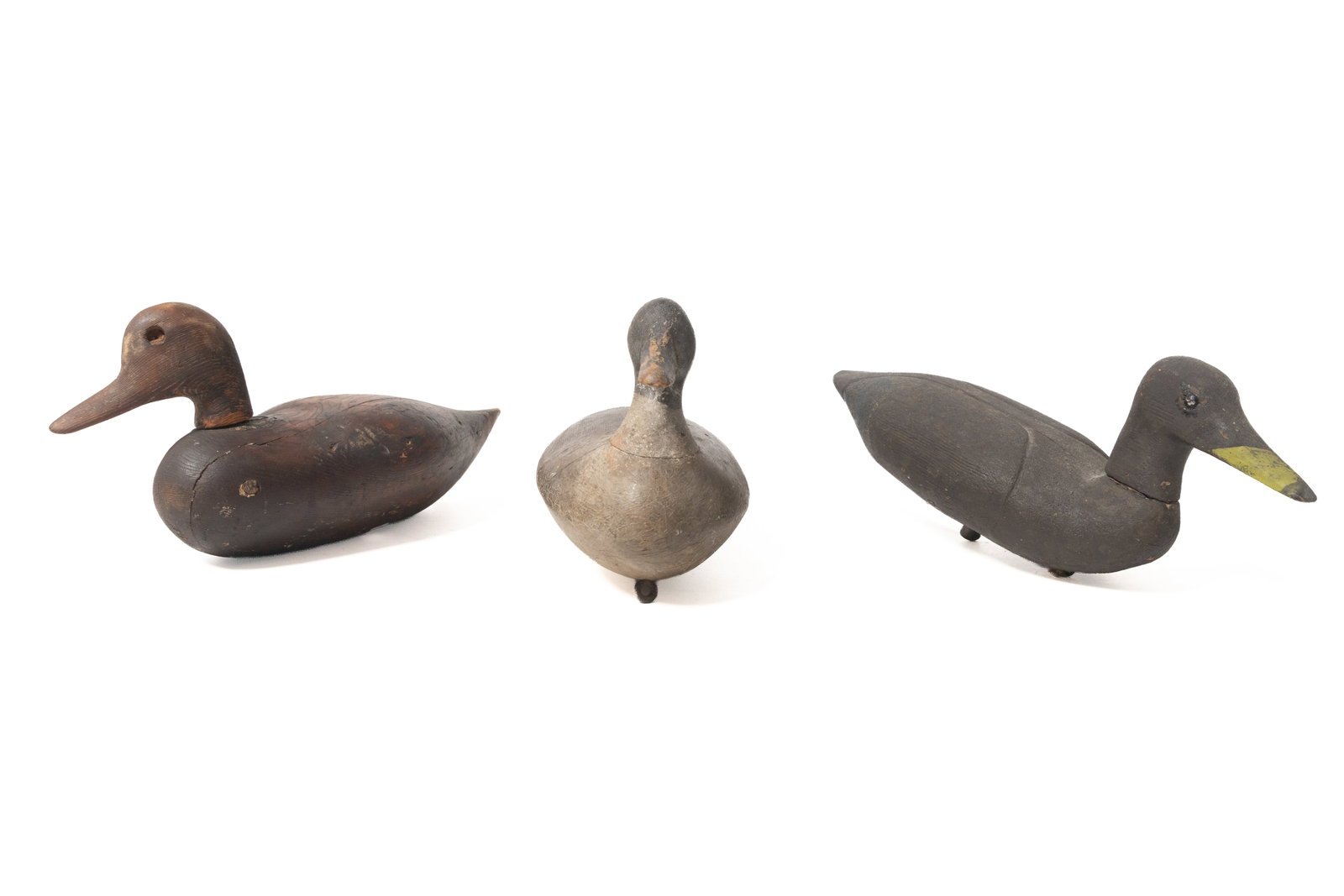 THREE CARVED AND PAINT-DECORATED WORKING DUCK DECOYS. (1 of 20)