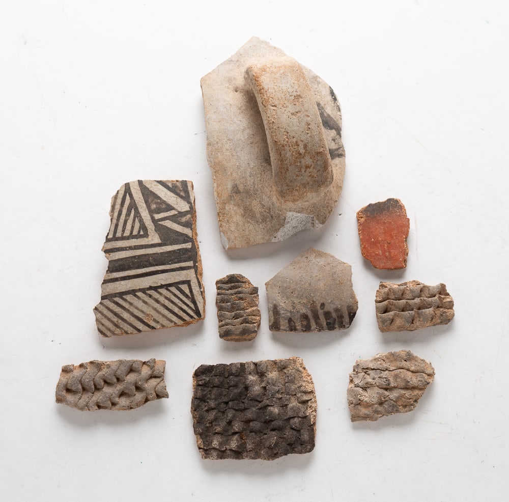 GROUP OF NATIVE AMERICAN POTTERY SHARDS.: GROUP OF NATIVE AMERICAN POTTERY SHARDS. Various nationalities, colors, and sizes. Nine pieces. Provenance: From the collection of the late Anita Vogelaar (Colorado, Florida, and Michigan).