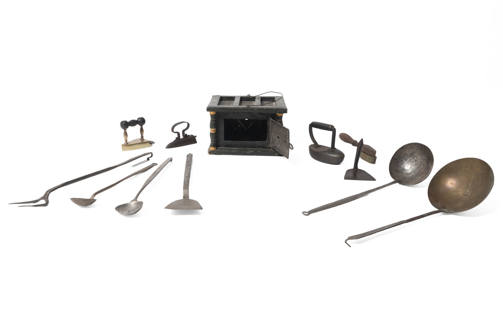COLLECTION OF KITCHEN ITEMS.: COLLECTION OF KITCHEN ITEMS. American, second half 19th Century. Three irons, iron in brass holder with plume imprint, pastry board scraper, foot warmer with original green paint and gold, white, and 