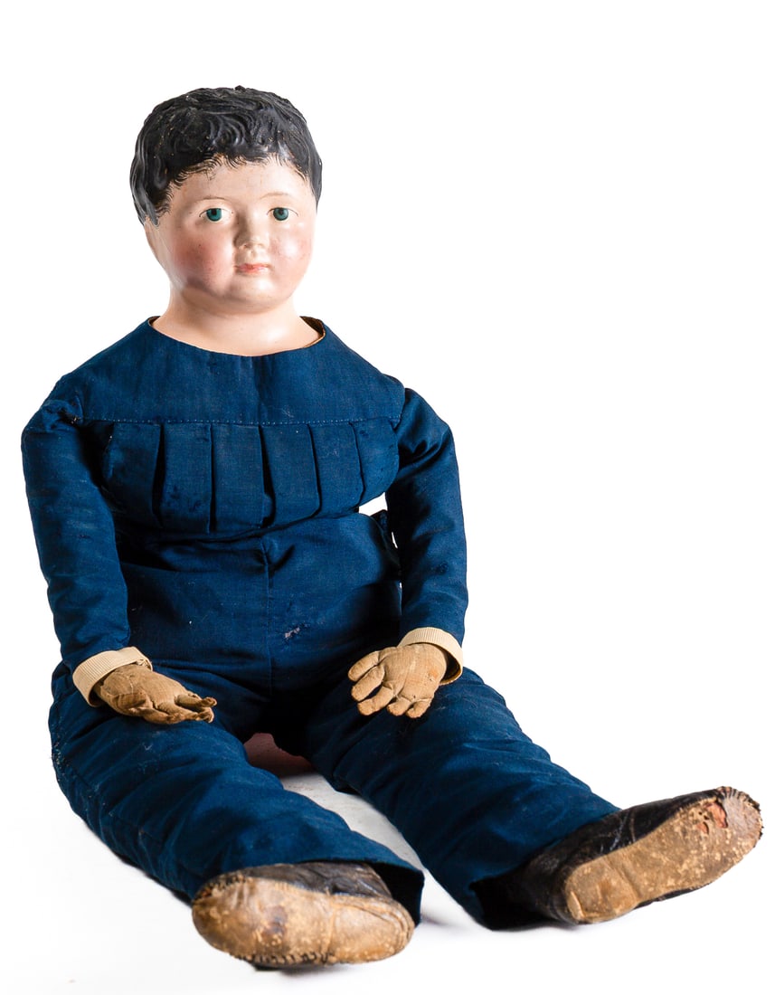 BOY DOLL WITH PAPIER-MACHE HEAD.: BOY DOLL WITH PAPIER-MACHE HEAD. American, 19th Century. Doll with papier-mache head and shoulders, soft body with worn hands, and wearing his original blue jumpsuit and leather shoes. 29"h. Provenanc