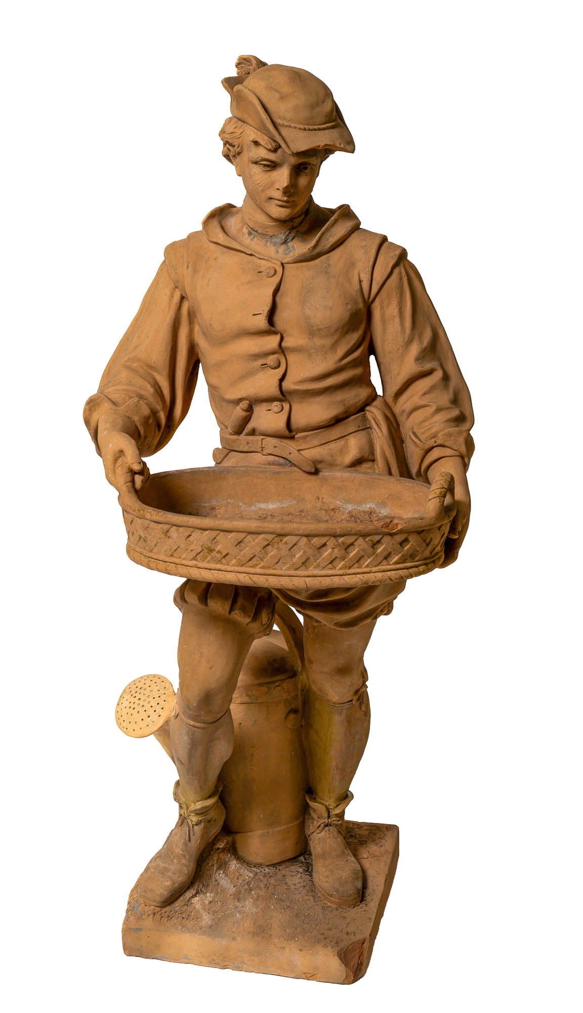TERRACOTTA GARDEN STATUE OF A YOUNG MAN.: TERRACOTTA GARDEN STATUE OF A YOUNG MAN. European, late 19th Century. Clothed in 17th-century-style clothing with high stockings, billowing shorts, waistcoat, shirt with puffy sleeves, and a hat. He