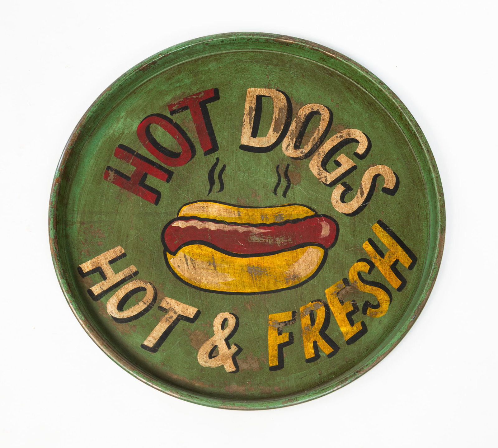LARGE PAINT-DECORATED TRAY.: LARGE PAINT-DECORATED TRAY. American, 20th Century. Circular tray with green paint and reads "HOT DOGS HOT & FRESH" with a hot dog in the center. 1.25"h. 21.75"d. Provenance: Deb Fisher (Lebanon,