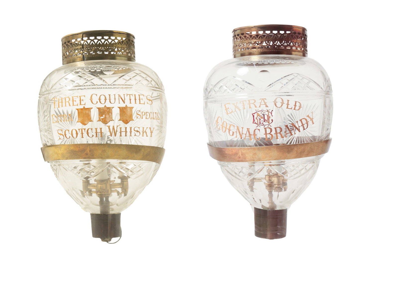 PAIR OF CUT GLASS ADVERTISING SCONCES.: PAIR OF CUT GLASS ADVERTISING SCONCES. English, late 19th Century. Teardrop-shaped, one engraved and gold-leafed "EXTRA OLD COGNAC BRANDY" and the other "THREE COUNTIES EXTRA FINE WHISKY". Both have