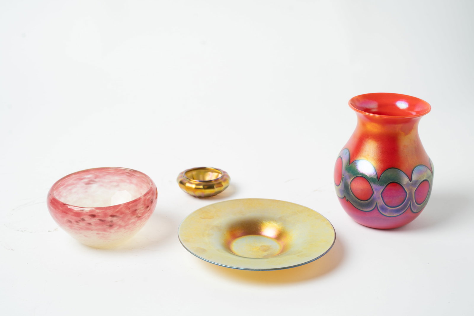 FOUR ART GLASS ITEMS, INCL. QUEZAL AND STEUBEN.: FOUR ART GLASS ITEMS, INCL. QUEZAL AND STEUBEN. 20th Century. Three are American: Quezal iridized ribbed salt dip, signed inside polished pontil, 2.5"d., Charles Lotton orange bulbous vase, iridized