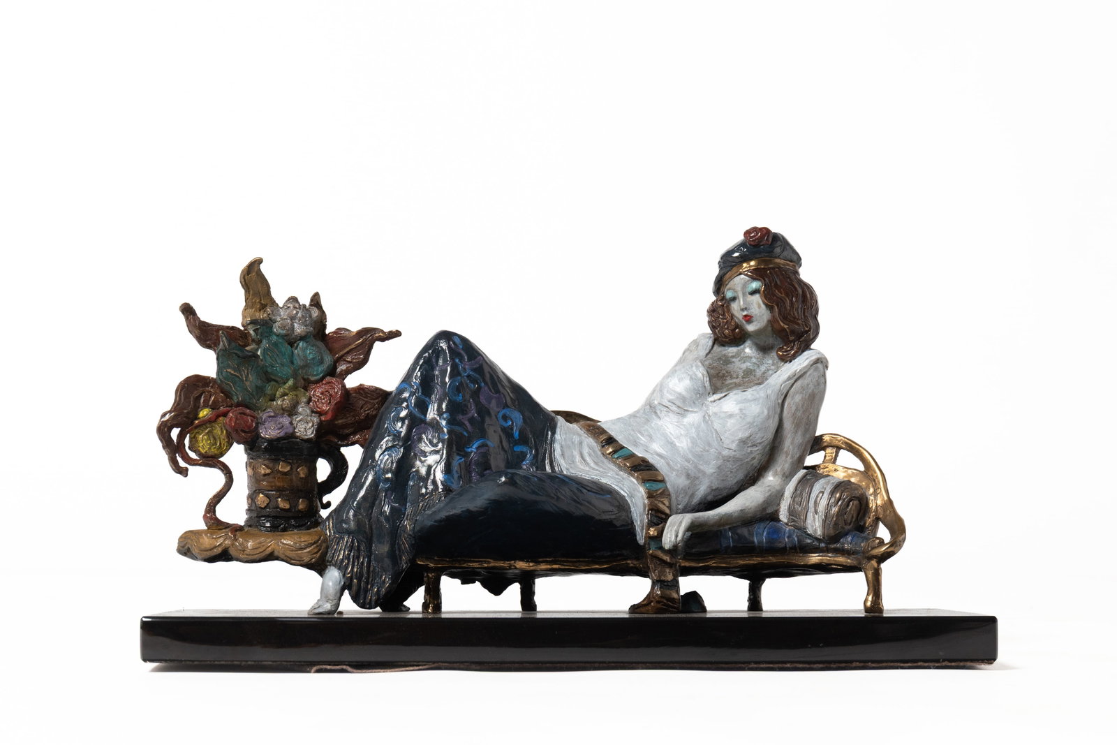 ITZCHAK TARKAY (ISRAELI, 1935-2012) "LA FIANCEE" BRONZE SCULPTURE, DATED 1994.: ITZCHAK TARKAY (ISRAELI, 1935-2012) "LA FIANCEE" BRONZE SCULPTURE, DATED 1994. Late 20th Century. Painted bronze depicting a woman lying on a daybed, next to a table with flowers. To back "LOGO ART