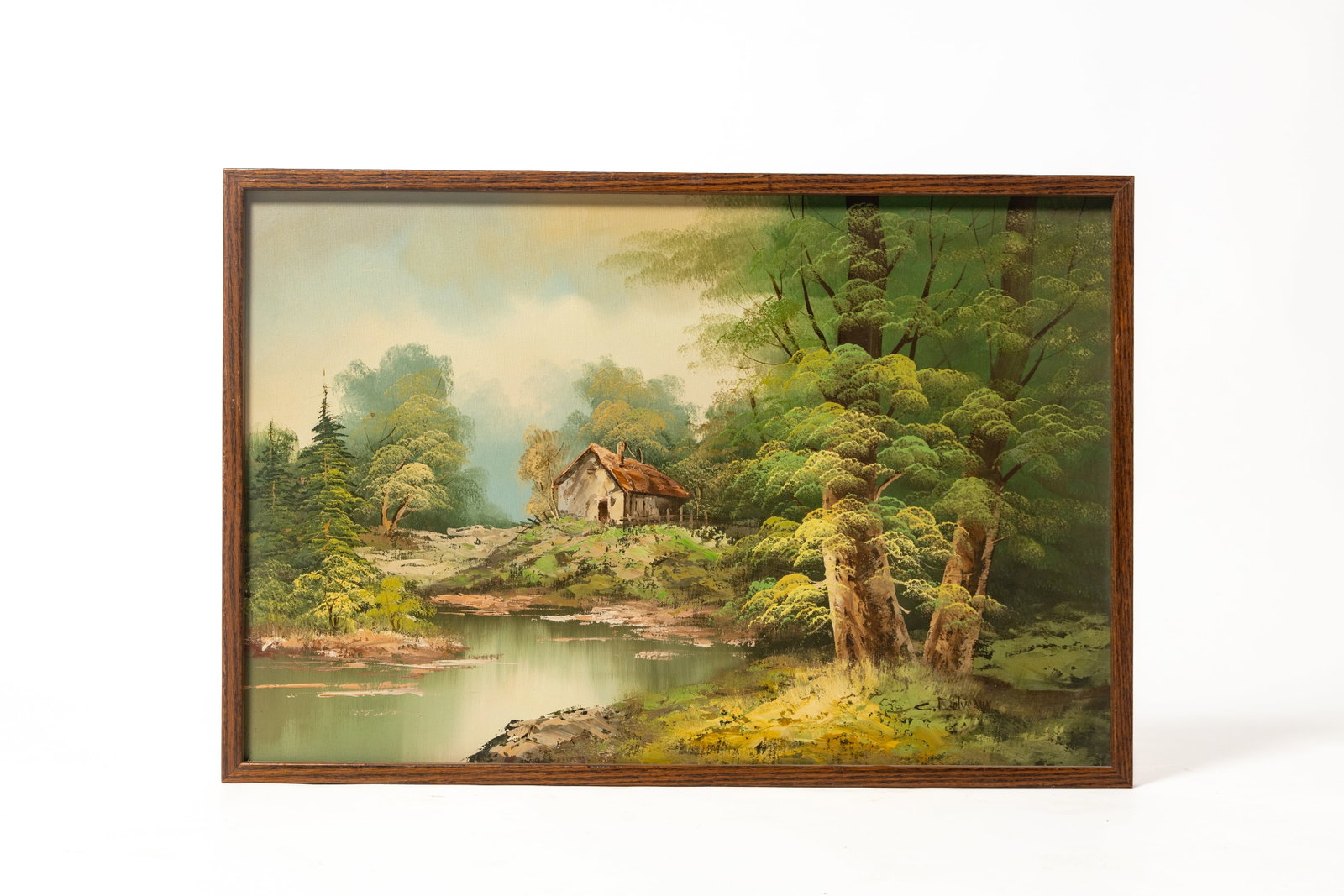 COUNTRY LANDSCAPE OIL ON CANVAS, SIGNED C. DELVEAUX.: COUNTRY LANDSCAPE OIL ON CANVAS, SIGNED C. DELVEAUX. American or European, 20th Century. A view of a cottage nestled in a tree-filled area near water. Sight, 23.75"h. 35.5"w. Framed, 25"h. 37"w.
