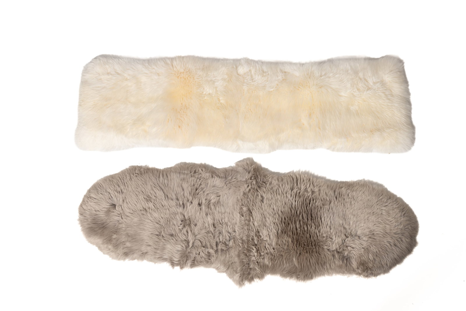 TWO AUSTRALIAN AND NEW ZEALAND NATURAL SHEEPSKIN RUNNERS.