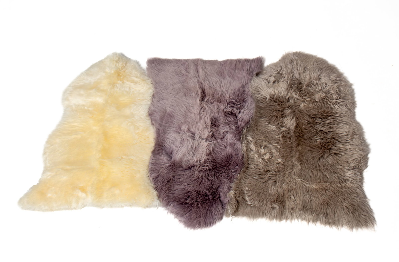 THREE AUSTRALIAN AND NEW ZEALAND NATURAL SHEEPSKIN RUGS.