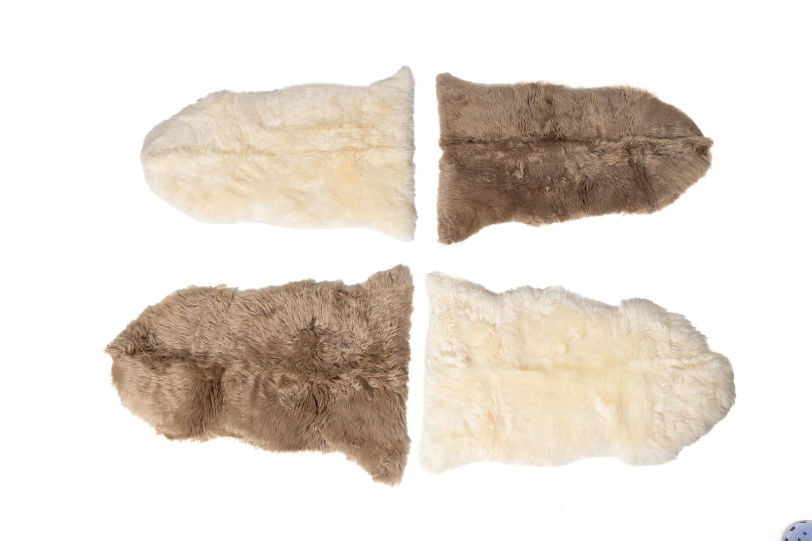 FOUR AUSTRALIAN AND NEW ZEALAND NATURAL SHEEPSKIN RUGS. (1 of 3)