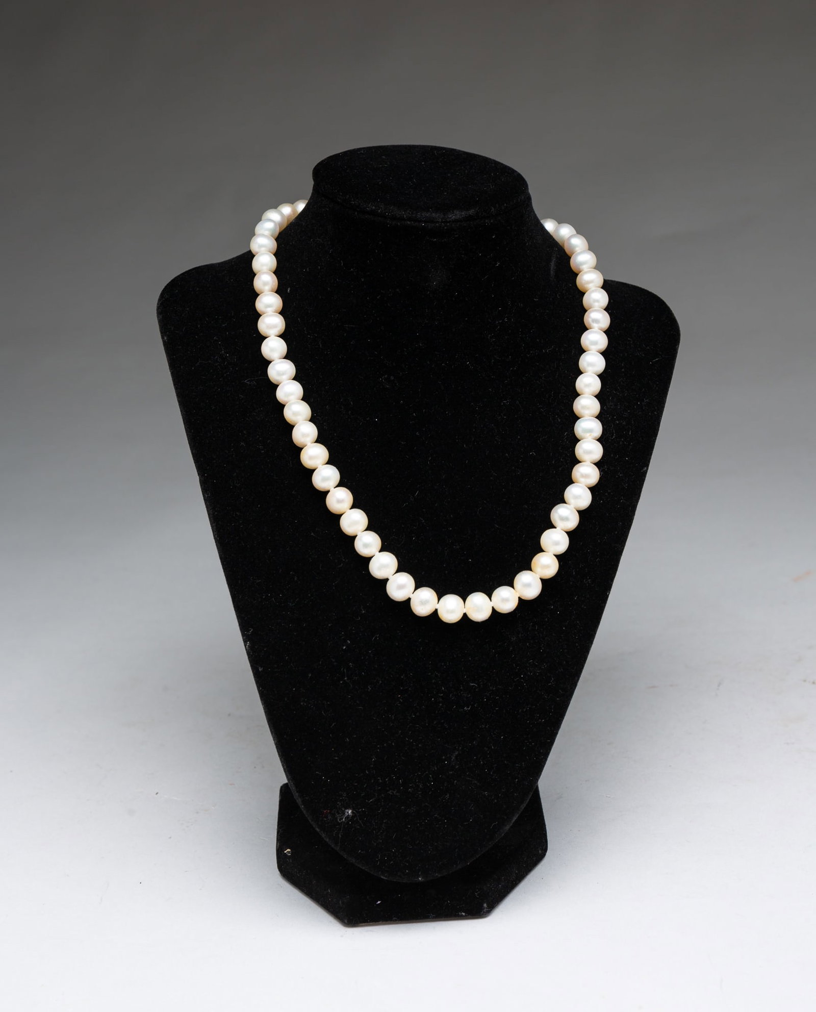 LAGOS "LUNA" STERLING SILVER CLASPED PEARL NECKLACE.: LAGOS "LUNA" STERLING SILVER CLASPED PEARL NECKLACE. American, contemporary. A strand of cultured freshwater pearls with a sterling silver box clasp with safety catch. Pearls measure 8-9mm. 18"l. Prov