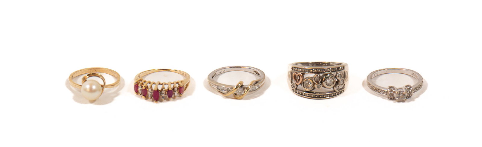 FIVE 10K GOLD AND GEMSTONE RINGS.: FIVE 10K GOLD AND GEMSTONE RINGS. Contemporary. A 10k white and yellow gold bridge-style ring set with one round brilliant-cut diamond, H/I2, 0.07ct., surrounded by twelve channel-set diamond baguette