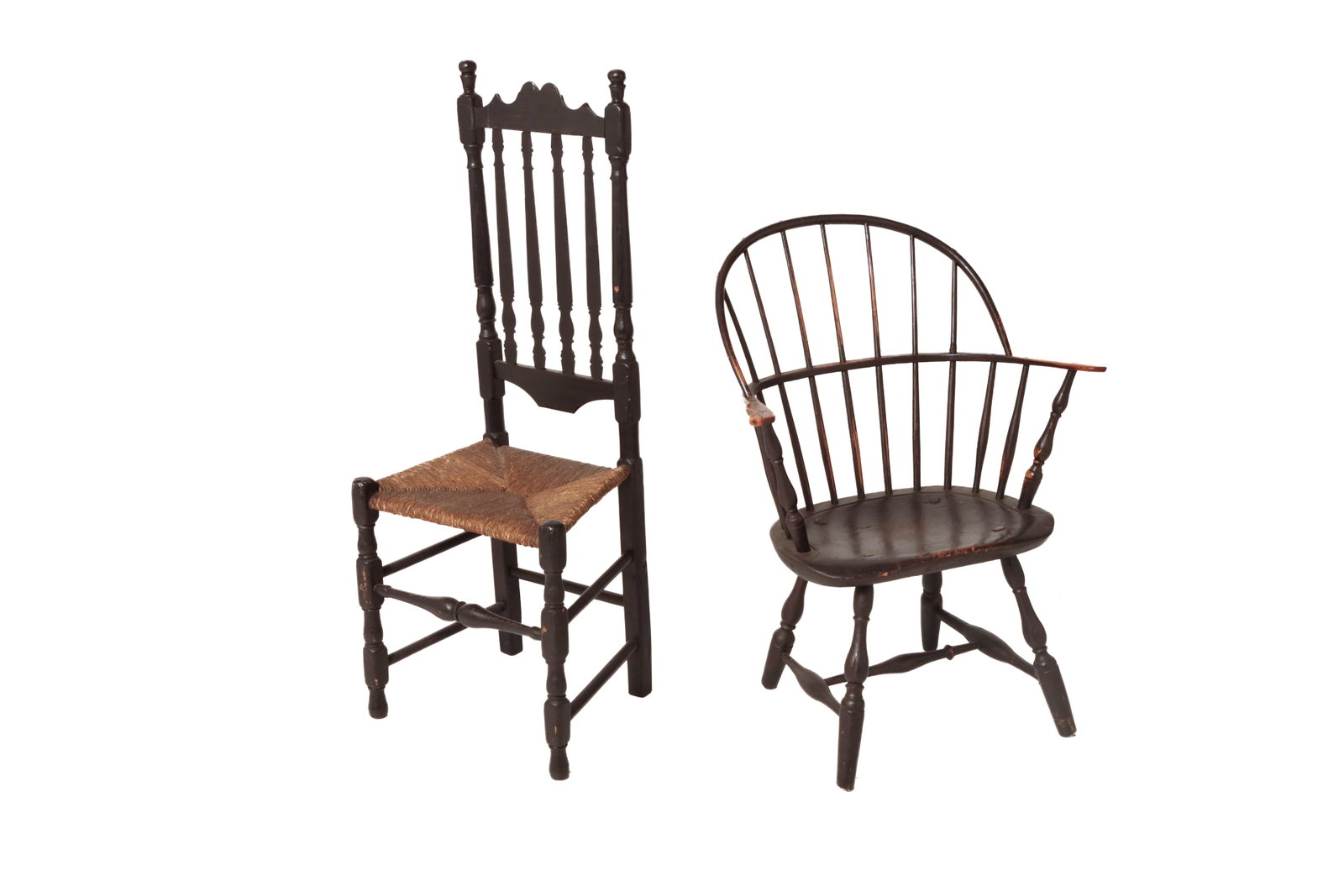 BANISTER BACK SIDECHAIR AND BOWBACK WINDSOR ARMCHAIR IN ORIGINAL BLACK PAINT.: BANISTER BACK SIDECHAIR AND BOWBACK WINDSOR ARMCHAIR IN ORIGINAL BLACK PAINT. American, 18th and 19th Century. Mixed woods. Banister back chair with shaped crest, ball finials, half-turned slats,