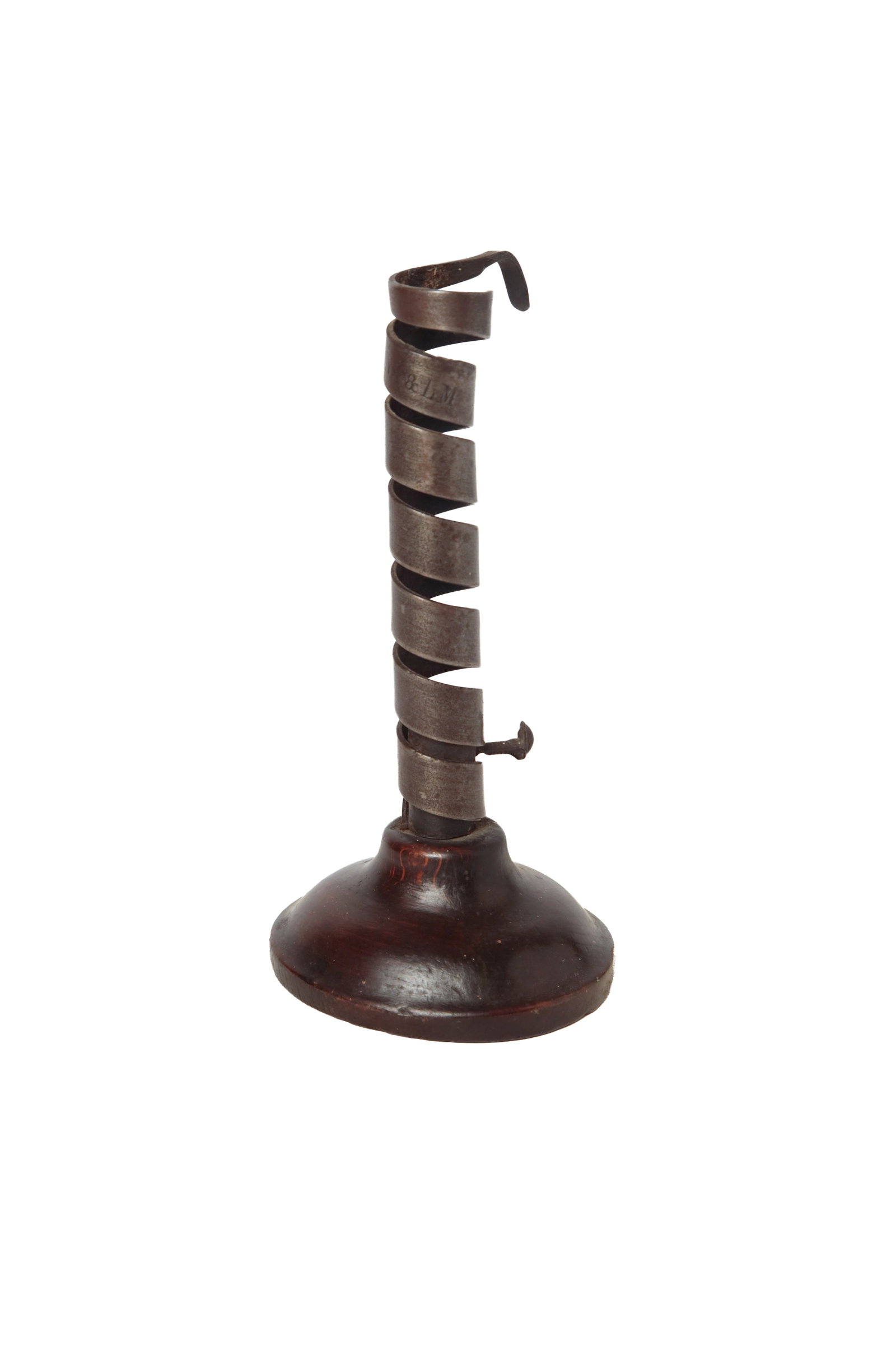 WROUGHT IRON SPIRAL COURTING CANDLESTICK, STAMPED "LNA & LM".: WROUGHT IRON SPIRAL COURTING CANDLESTICK, STAMPED "LNA & LM". American, 18th Century. Spiral form with push-up and hanging hook on oval wooden base. Stamped at top of spiral "LNA & LM". 7.75"h.