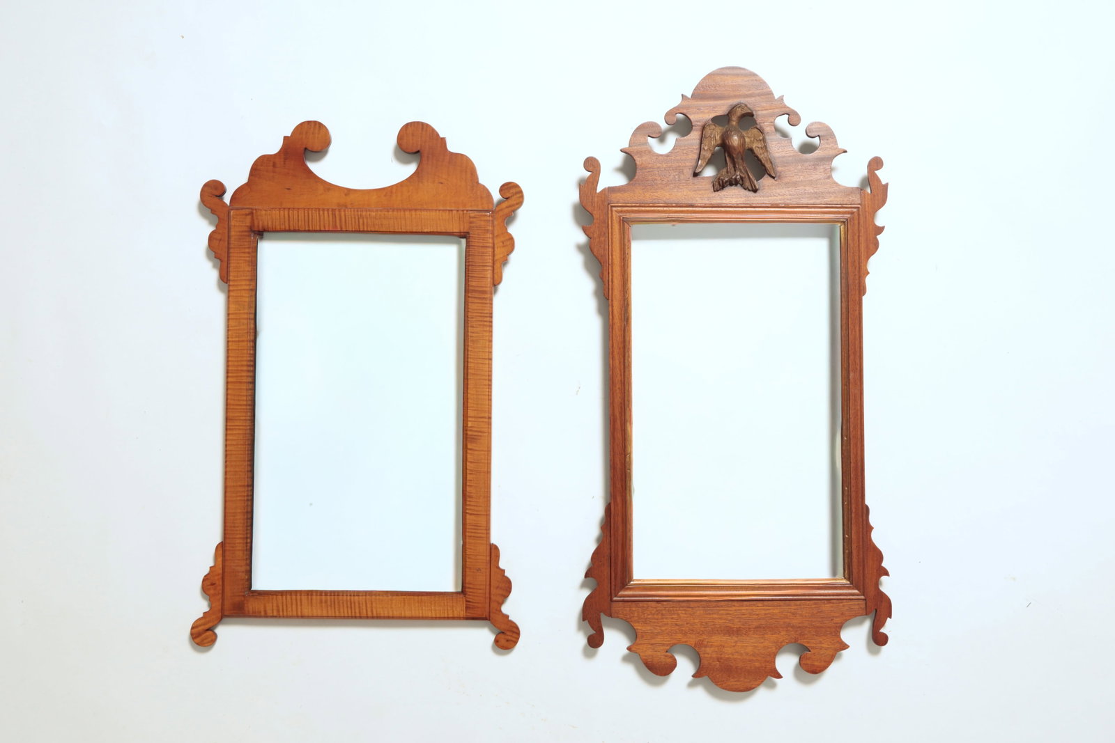 TWO CHIPPENDALE SCROLLWORK MIRRORS.: TWO CHIPPENDALE SCROLLWORK MIRRORS. American. One a Massachusetts example dating to the second half of 18th Century with pierced and carved mahogany frame with applied decoration on pediment. 36"h.