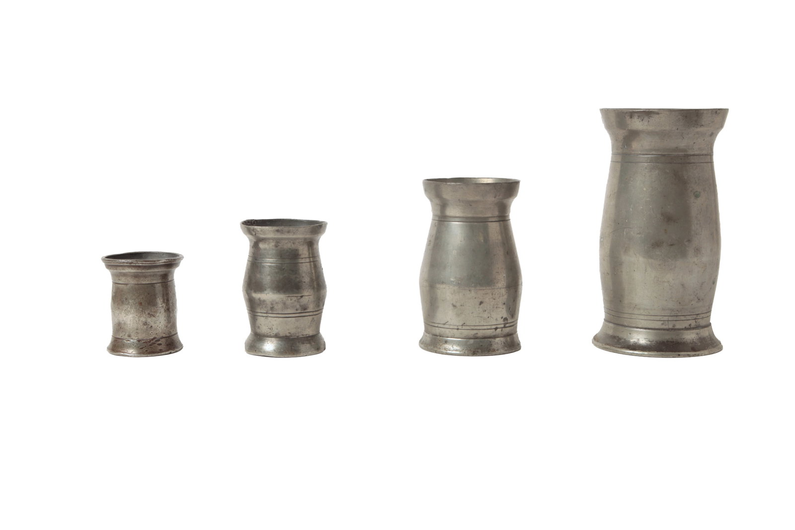 SET OF FOUR BIRMINGHAM PEWTER MEASURES.: SET OF FOUR BIRMINGHAM PEWTER MEASURES. English, early 19th Century. Handleless measures labeled "HALF PINT", "GILL", HALF GILL", and "1/4 GILL". One marked "GASKELL & CHAMBERS" to bottom. From 5"h.