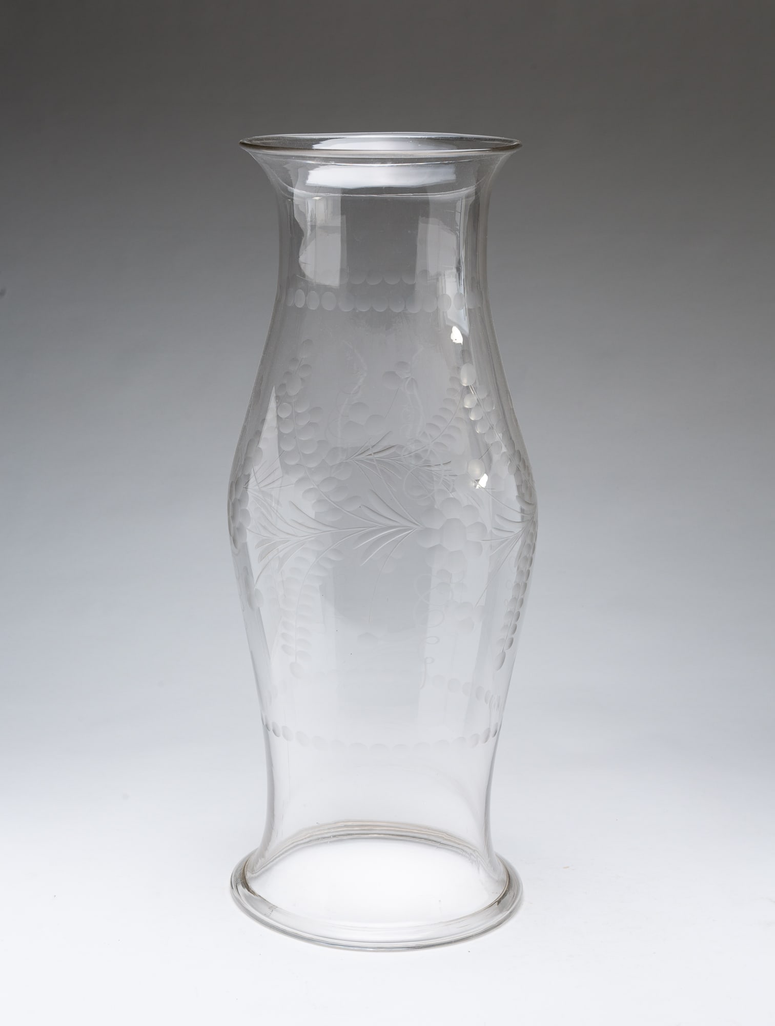 LARGE FLINT GLASS HURRICANE SHADE.: LARGE FLINT GLASS HURRICANE SHADE. American, 19th Century. With pronounced folded rim at base and etched designs of flowers and flourishes. 23.5"h. Provenance: From the Lifetime Collection of Marilyn 