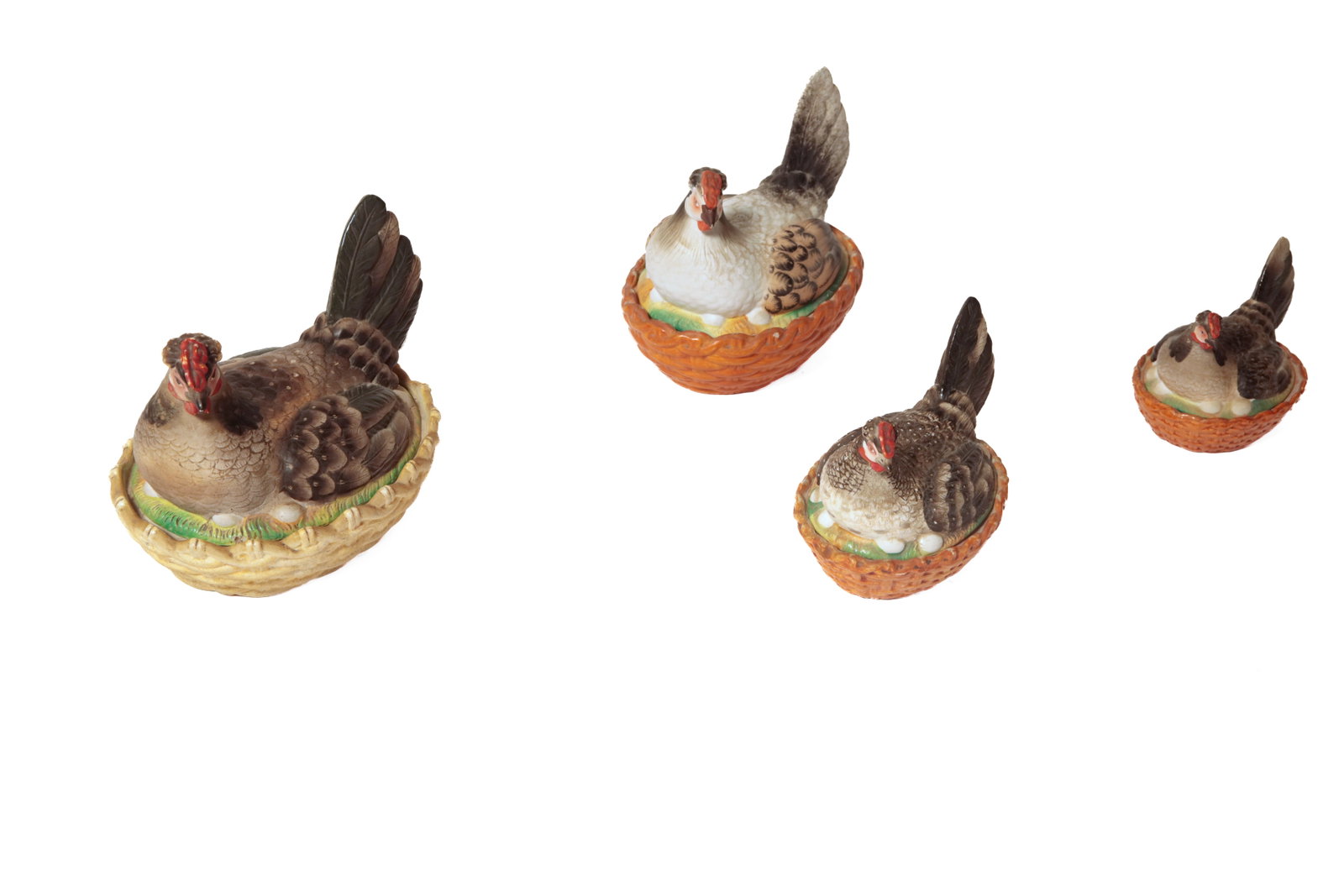 FOUR STAFFORDSHIRE PORCELAIN HENS ON NESTS.: FOUR STAFFORDSHIRE PORCELAIN HENS ON NESTS. English, second half 19th Century. In four sizes. Largest in mostly dark colors, 8.25"h., white, tan, and black, 7.75"h., black and gray, 6"h., and black,