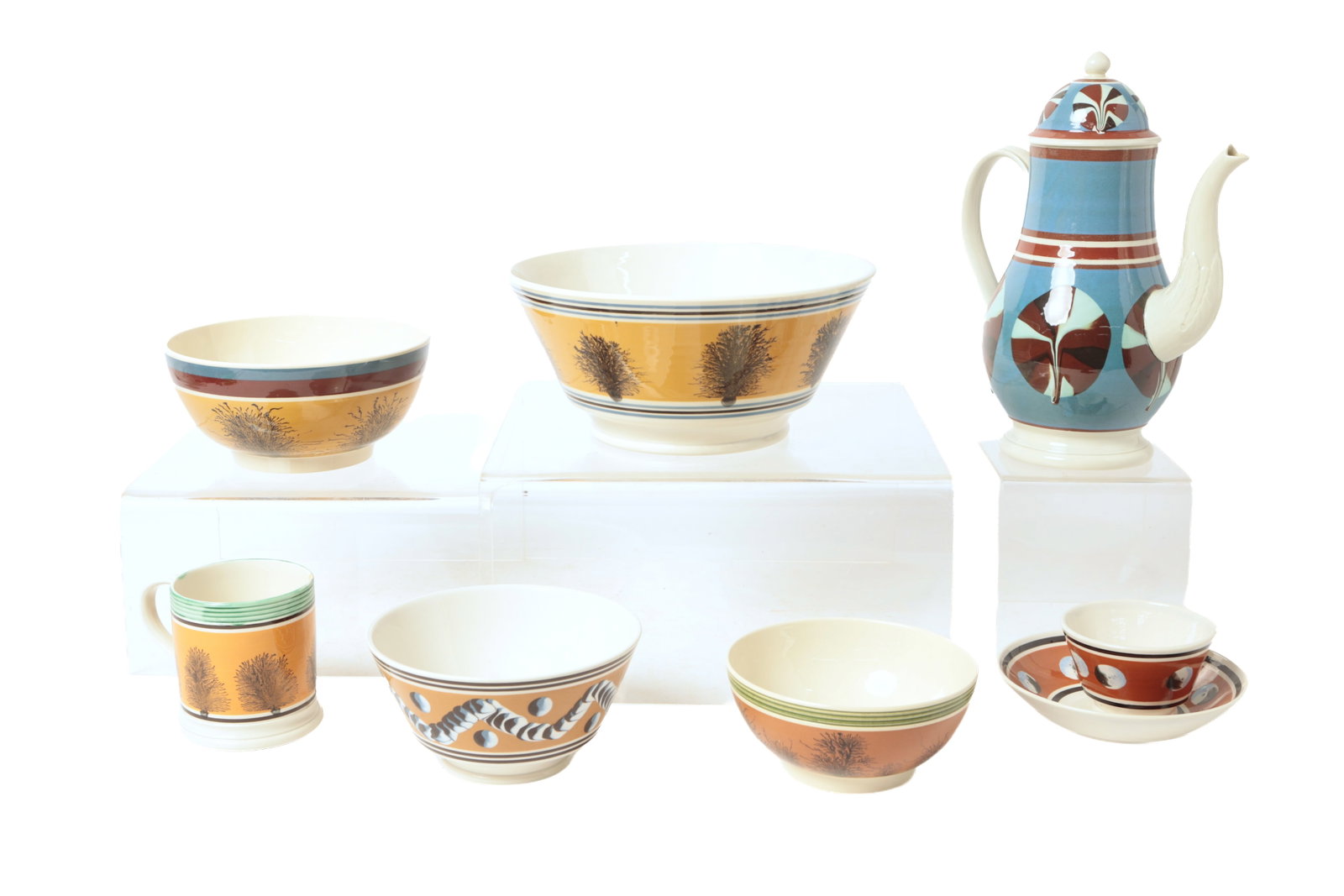 GROUPING OF DON CARPENTIER (NEW YORK, 1951-2014) REPRODUCTION MOCHAWARE.: GROUPING OF DON CARPENTIER (NEW YORK, 1951-2014) REPRODUCTION MOCHAWARE. American, 20th Century. Includes a large bowl with seaweed decoration, 4.5"h. 10"d., a bowl with seaweed decoration, 3.5"h.