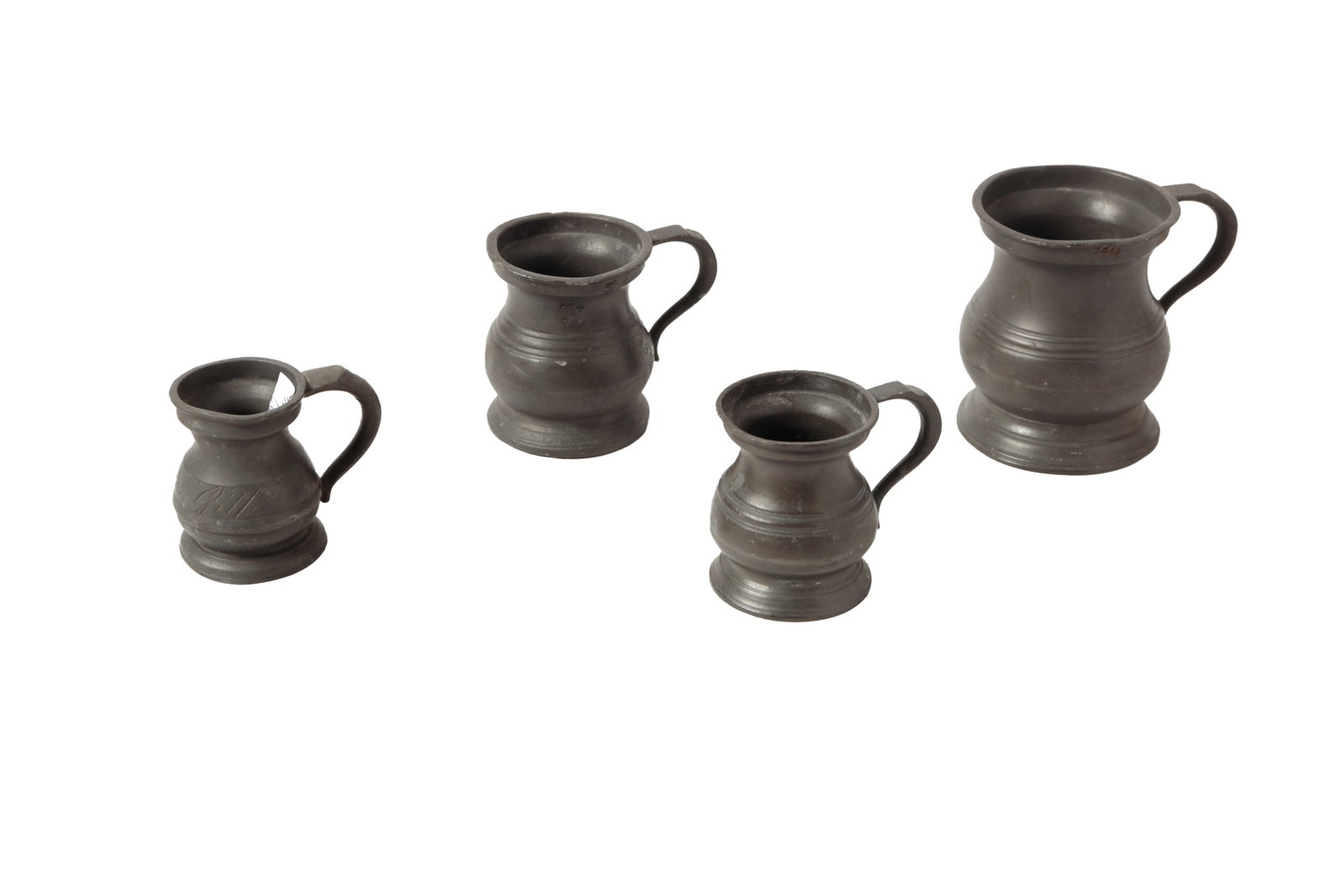 SET OF FOUR GRADUATED BELLIED PEWTER MEASURES.: SET OF FOUR GRADUATED BELLIED PEWTER MEASURES. English, 19th Century. Labeled and with touchmarks. Includes a quartern, 1/2 quartern, 1/12 pint, and quarter gill. From 3"h. to 2"h. Cataloguer's note: