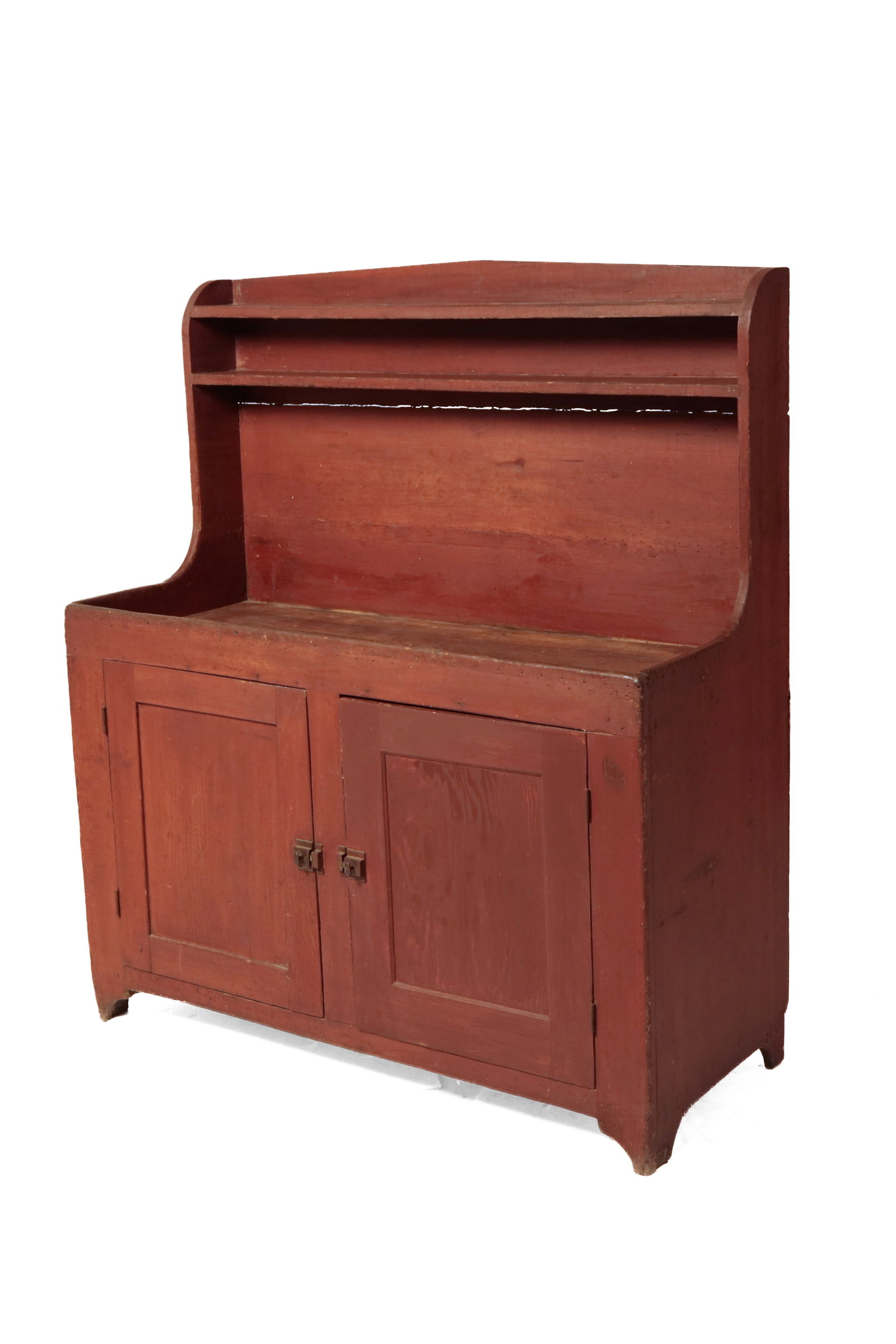 HIGH-BACK DRY SINK WITH RED PAINT.: HIGH-BACK DRY SINK WITH RED PAINT. American, second quarter 19th Century. Poplar. Back with two shelves, shaped ends, well, two lower single panel doors with center stile and simple cut out legs.