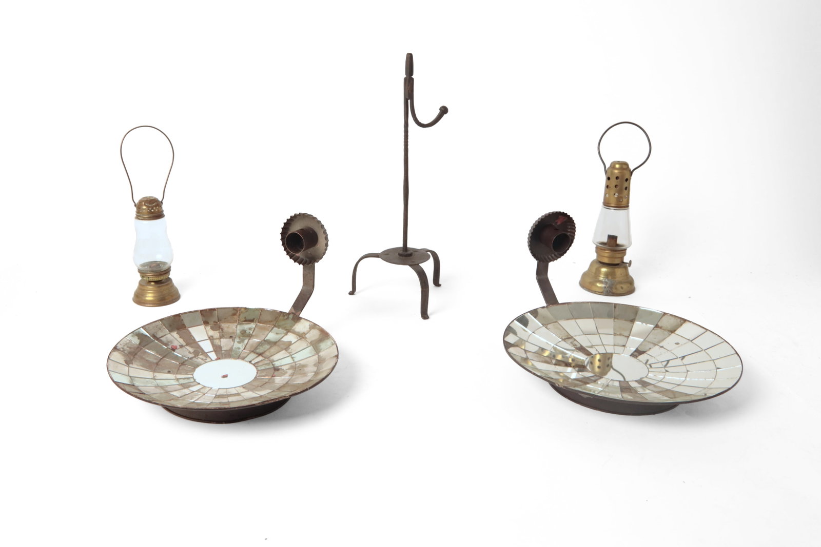 FIVE LIGHTING ITEMS.: FIVE LIGHTING ITEMS. American, 19th and 20th Century. Wrought iron tabletop rush light, twisted stem and counterweight on a tripod base, 16"h., two brass skaters lamps with wire ball handles, 9"h,