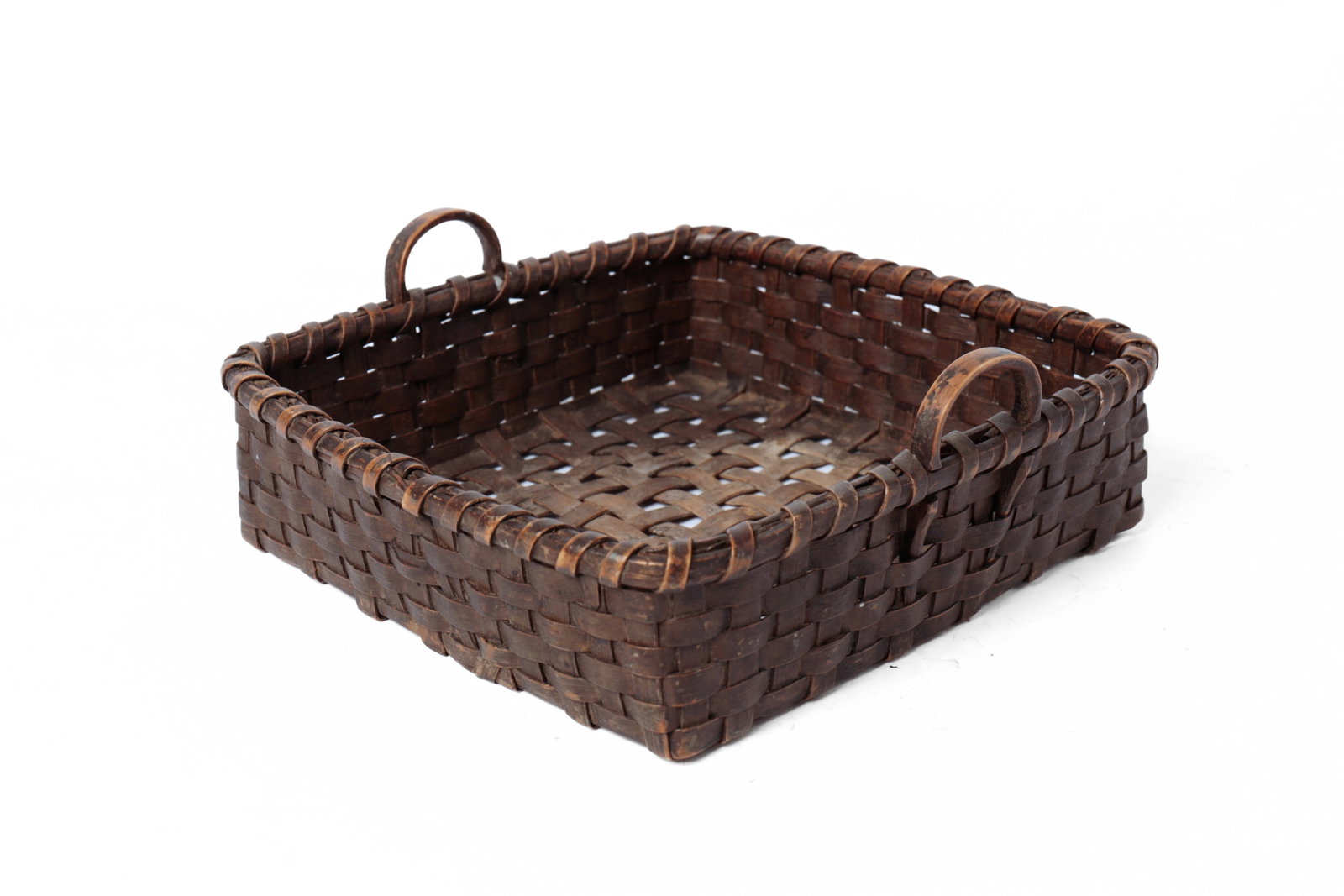 SQUARE PAINTED WOVEN SPLINT BASKET.: SQUARE PAINTED WOVEN SPLINT BASKET. American, 19th Century. Square form, tightly woven sides, loosely woven bottom, wrapped rim, and two bentwood handles. In an all-over dark paint.