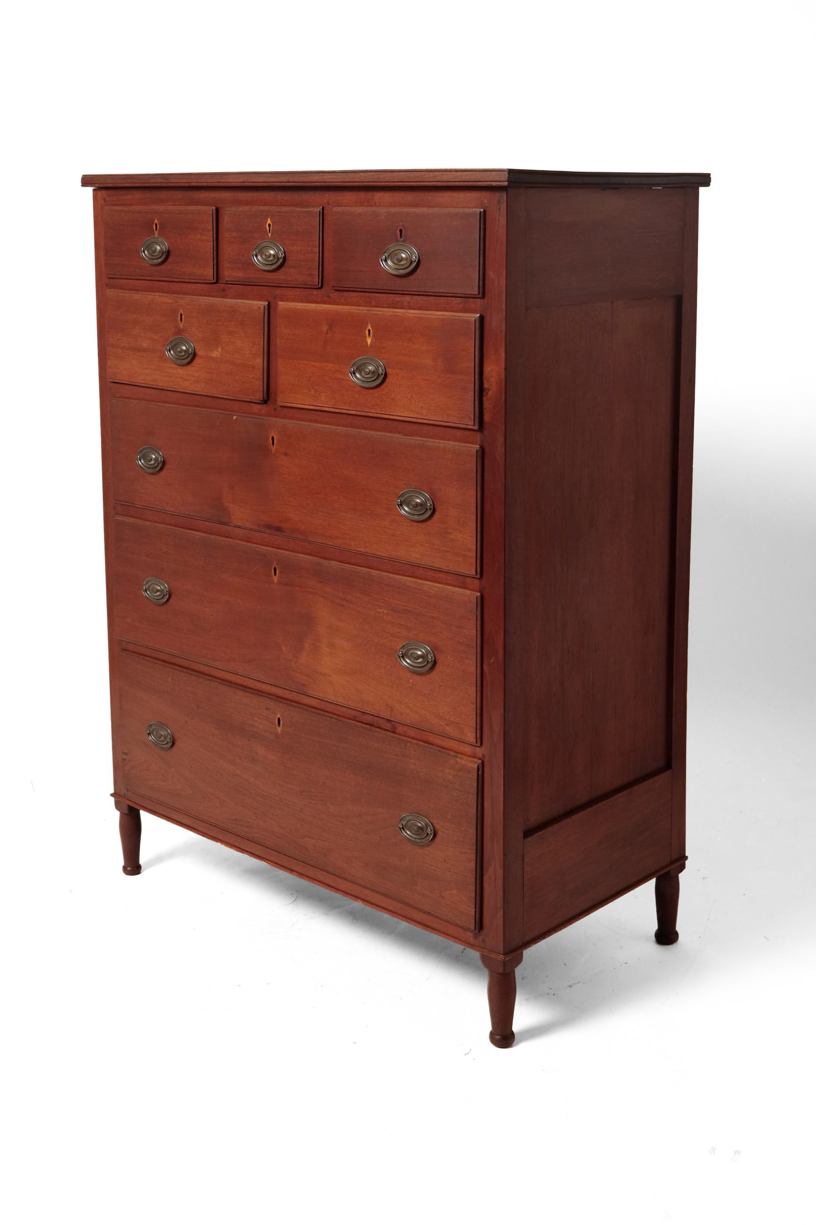 SHERATON TALL CHEST.: SHERATON TALL CHEST. American, early 19th Century. Walnut with poplar secondary. Top with beaded edge, paneled ends, eight overlapping drawers, and turned legs. 54.75"h. 41"w. 21"d. Provenance: From