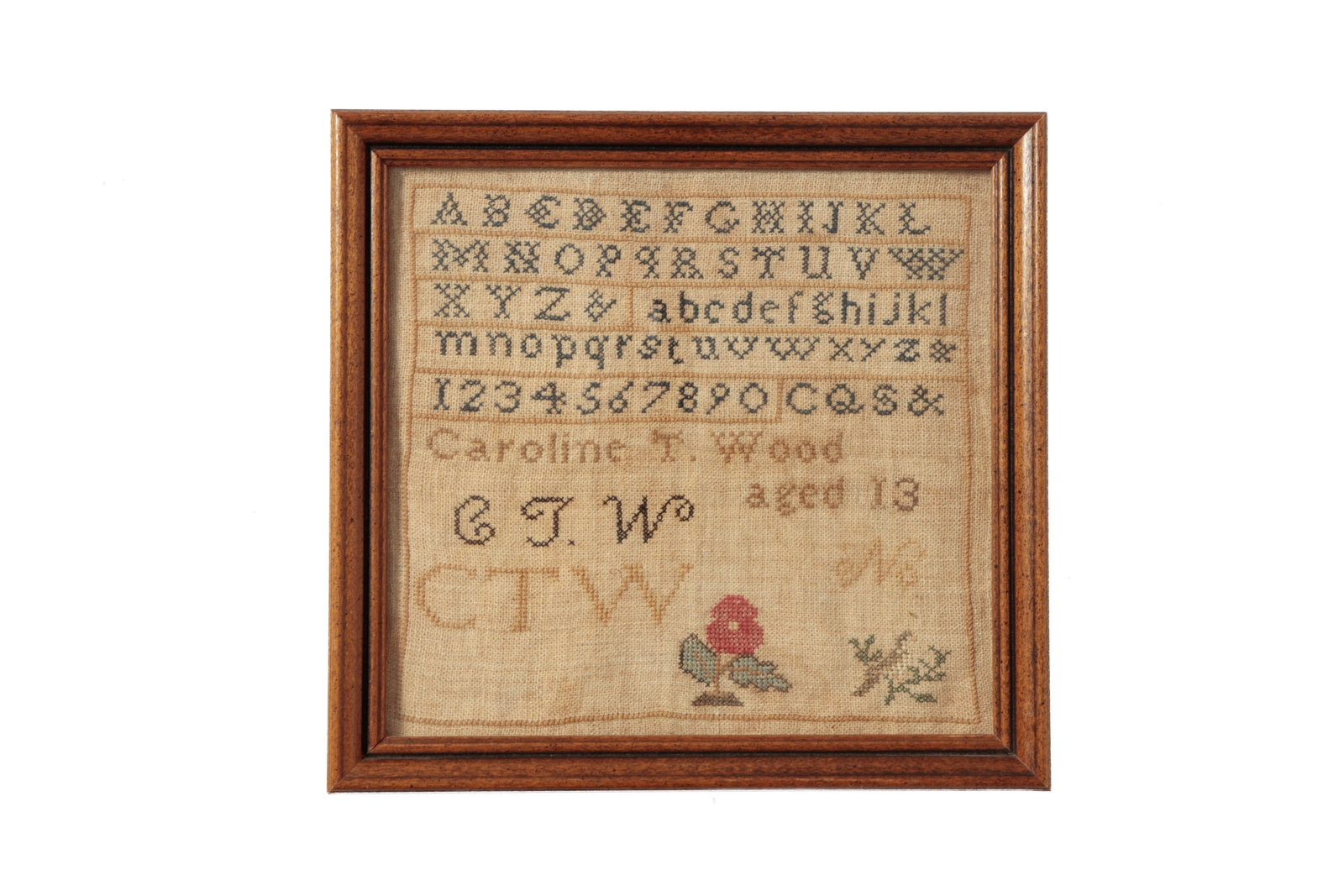NEEDLEWORK SAMPLER BY CAROLINE T. WOOD.: NEEDLEWORK SAMPLER BY CAROLINE T. WOOD. American (New England), 19th Century. Polychrome thread on linen. Rows of alphabets and numbers, a flower and a bird on a branch, two sets of initials