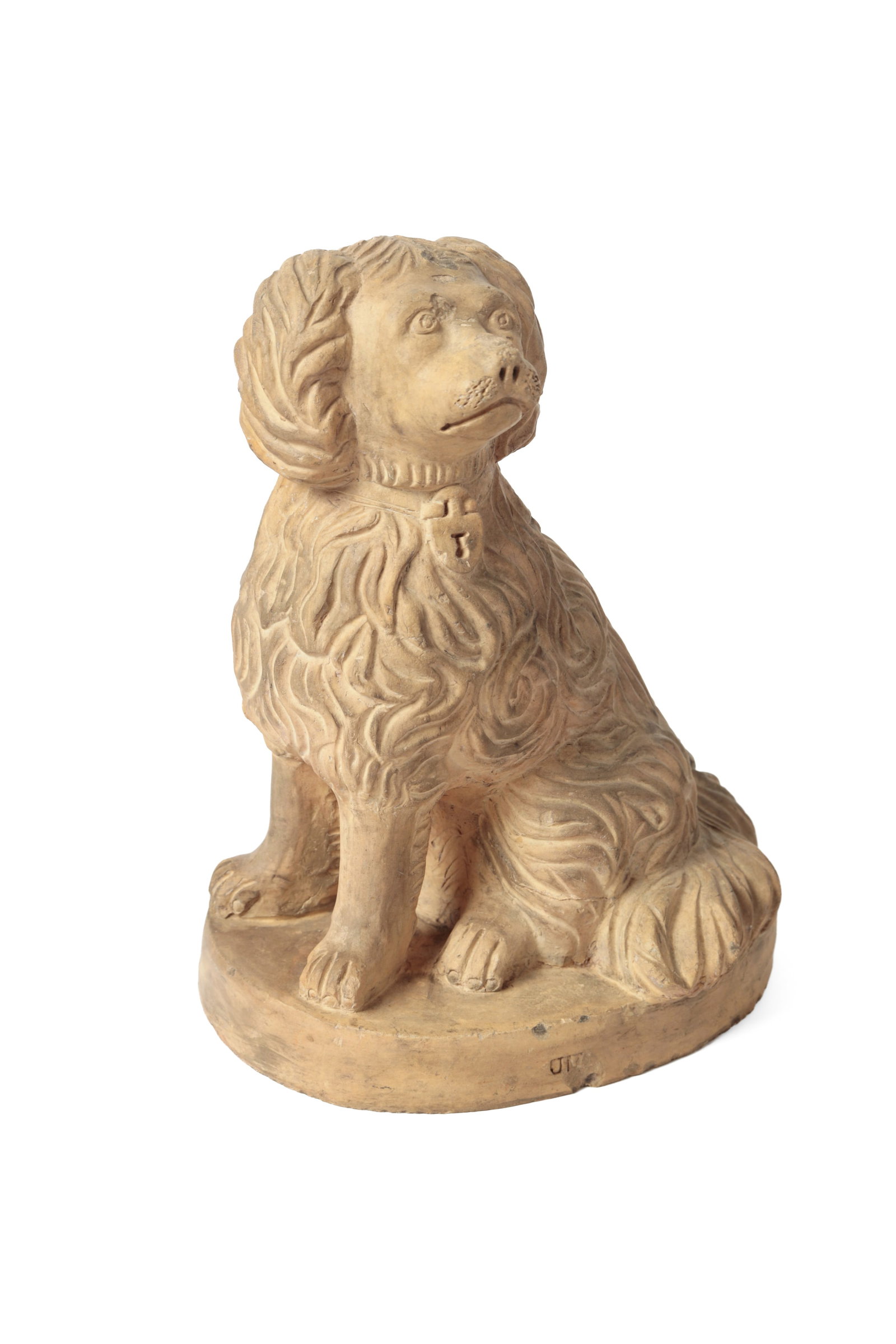 OHIO BUFF CLAY SEATED SPANIEL.: OHIO BUFF CLAY SEATED SPANIEL. American, late 19th Century. Seated spaniel with nice detailing, free-standing front legs, collar with a lock, and a large, bushy tail, atop an oval base stamped "JM". 1
