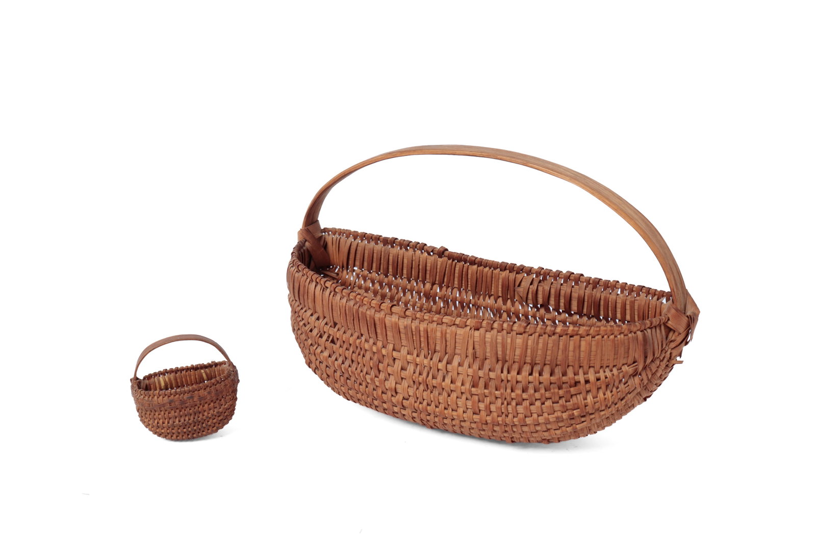 TWO WOVEN SPLINT HALF-BASKETS.: TWO WOVEN SPLINT HALF-BASKETS. American, 19th Century. A diminutive half-basket with woven ribs, wrapped edge, and a bentwood handle, 6.75â€h. 10.75â€w. And a miniatu