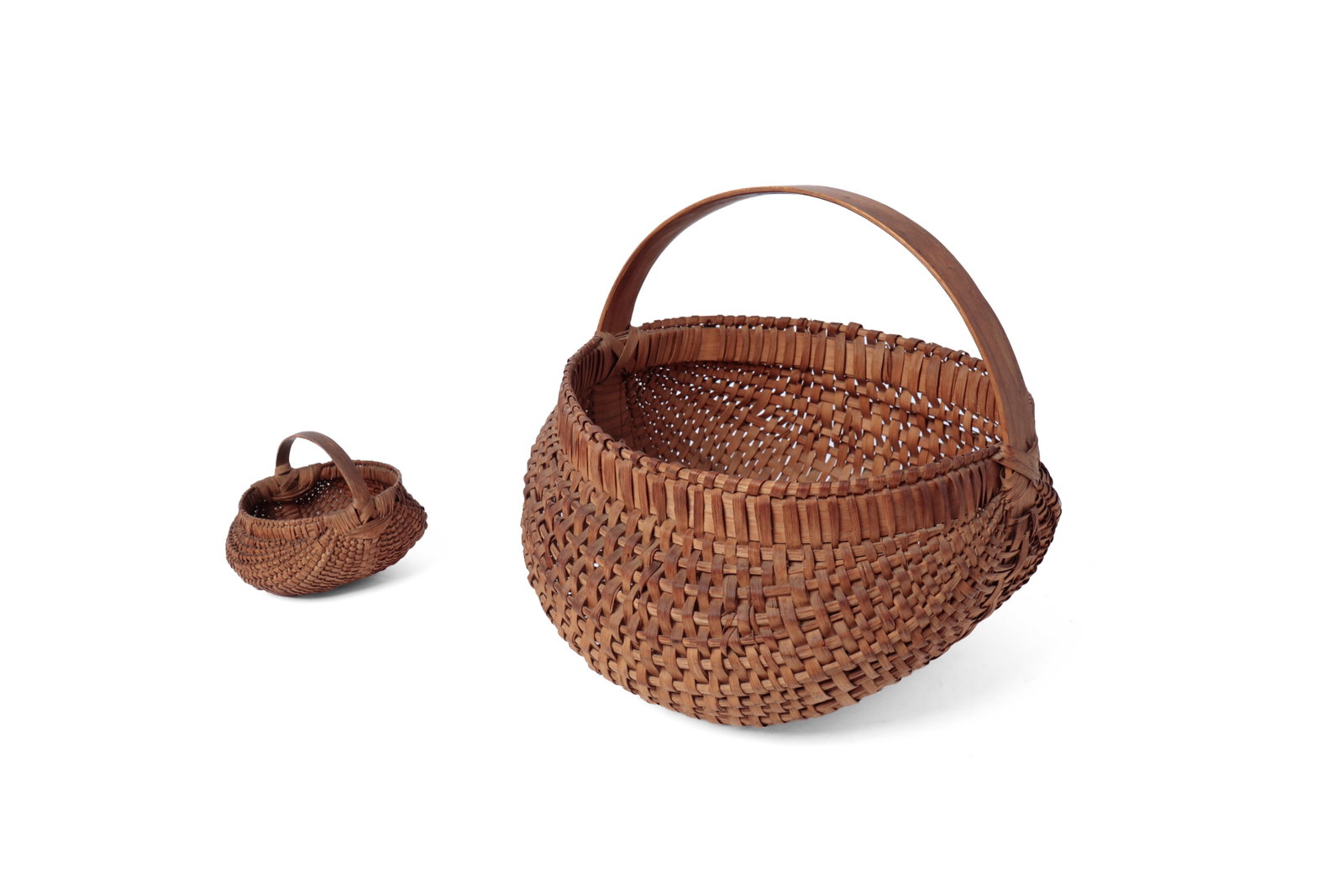 TWO WOVEN SPLINT BUTTOCKS BASKETS. - 2