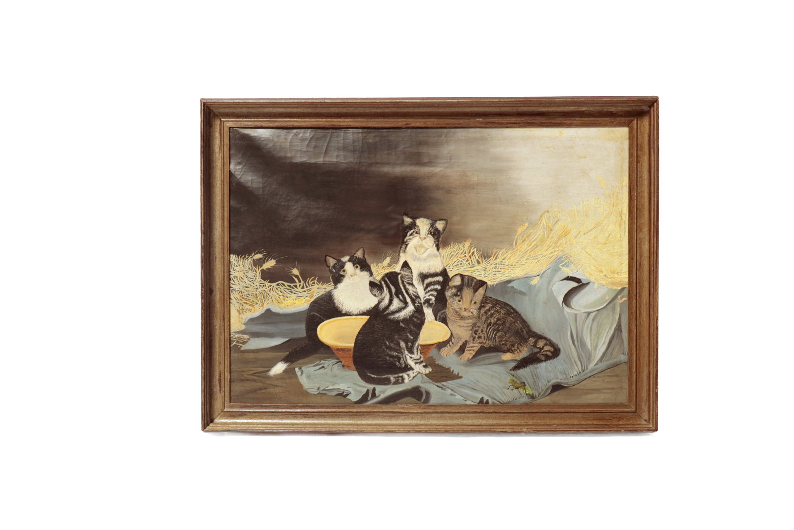 AMERICAN SCHOOL OIL ON CANVAS OF CATS.: AMERICAN SCHOOL OIL ON CANVAS OF CATS. 19th Century. Unsigned. A view of four kittens, huddled around a bowl, on a straw-filled bed with a grasshopper on the edge. 18.75"h. 27"w. In a wooden frame,
