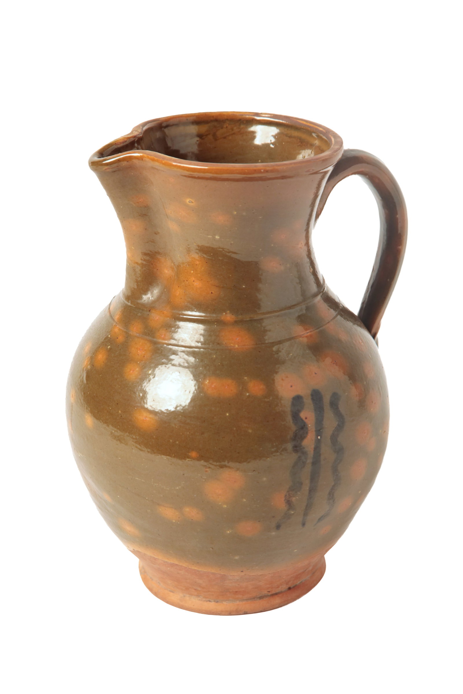 REDWARE PITCHER WITH MOTTLED GLAZE.: REDWARE PITCHER WITH MOTTLED GLAZE. American, 19th Century. Typical form with tall neck, shaped spout, bands at neck, bulbous body with applied strap handle, and a mottled green glaze with three squig