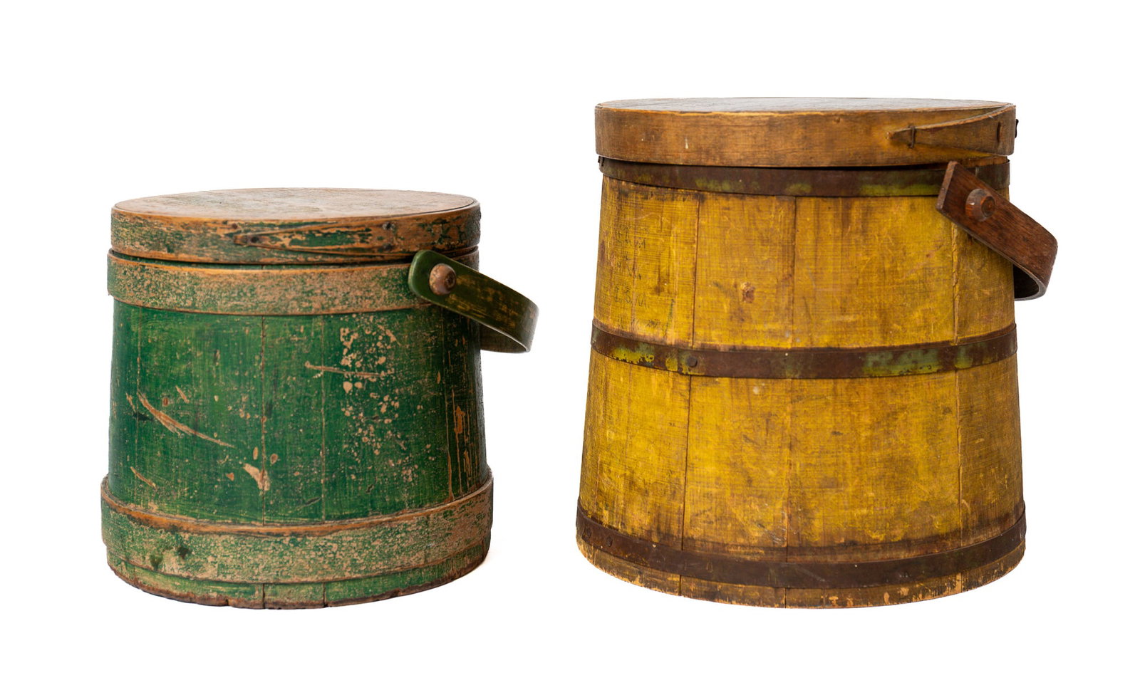 TWO PAINTED STAVE CONSTRUCTED FIRKINS.: TWO PAINTED STAVE CONSTRUCTED FIRKINS. American, 19th Century. One in worn green paint, tacked finger joints and a bentwood swing handle, 8.75"h. 9.75"w. And a mustard-painted firkin with metal